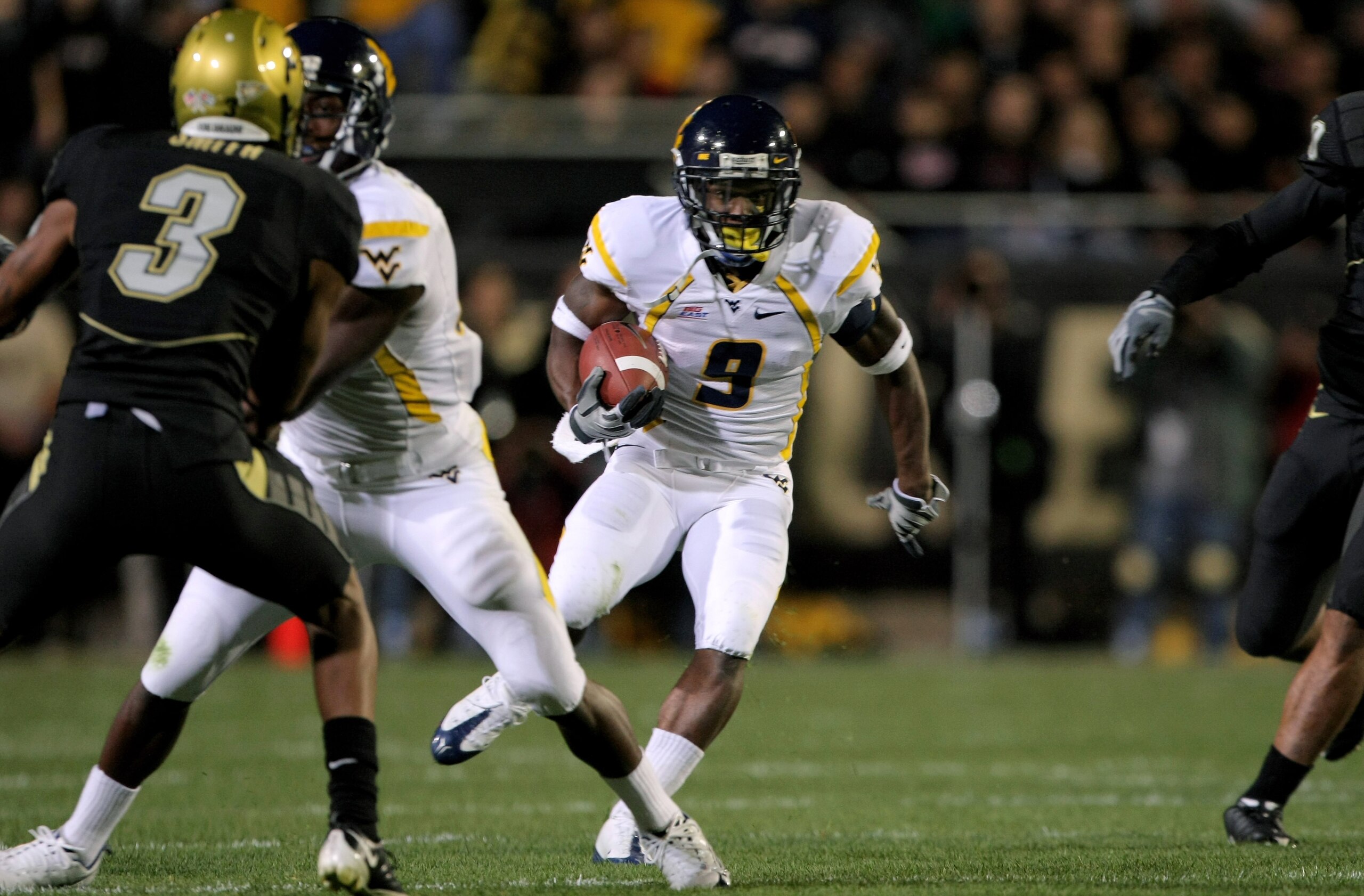 BOULDER, CO - SEPTEMBER 18: Jock Sanders #9 of the West Virginia Mountaineers rushes against the Colorado Buffaloes at Folsom Field on September 18, 2008 in Boulder, Colorado. (Photo by Doug Pensinger/Getty Images) BOULDER, CO - SEPTEMBER 18: Jock Sanders #9 of the West Virginia Mountaineers rushes against the Colorado Buffaloes at Folsom Field on September 18, 2008 in Boulder, Colorado. (Photo by Doug Pensinger/Getty Images)