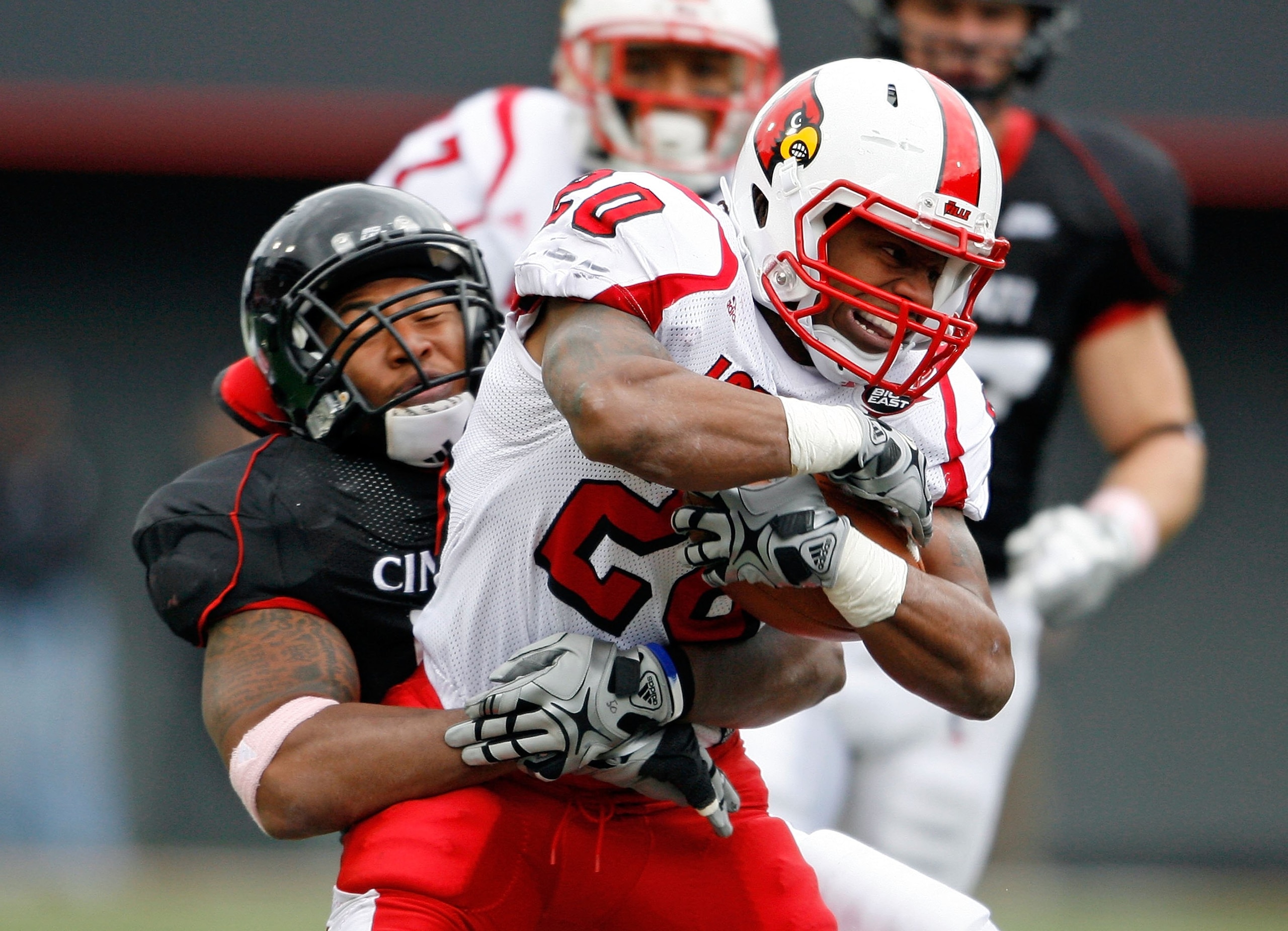 CINCINNATI - OCTOBER 24: Victor Anderson #20 of the Louisville Cardinals runs with the ball during the Big East Conference game against the Cincinnati Bearcats at Nippert Stadium on October 24, 2009 in Cincinnati, Ohio. (Photo by Andy Lyons/Getty Images CINCINNATI - OCTOBER 24: Victor Anderson #20 of the Louisville Cardinals runs with the ball during the Big East Conference game against the Cincinnati Bearcats at Nippert Stadium on October 24, 2009 in Cincinnati, Ohio. (Photo by Andy Lyons/Getty Images