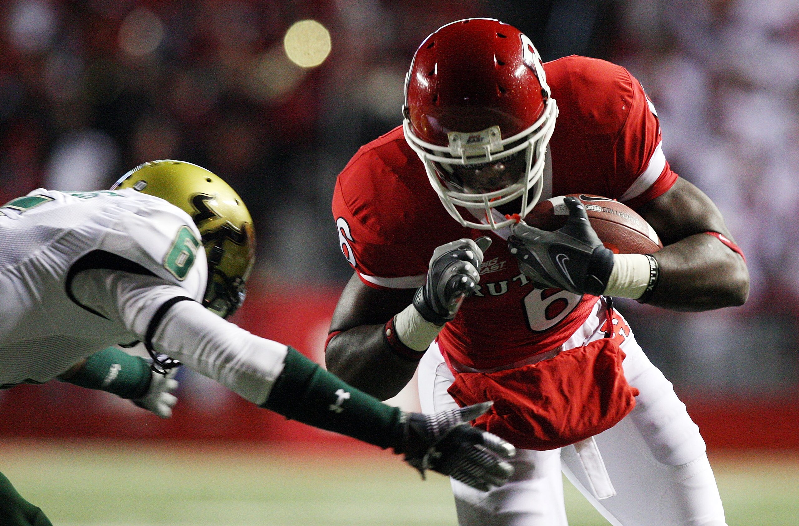 PISCATAWAY, NJ - NOVEMBER 12: Mohamed Sanu #6 of the Rutgers Scarlet Knights breaks past Kayvon Webster #6 of the South Florida Bulls for a first quarter touchdown at Rutgers Stadium on November 12, 2009 in Piscataway, New Jersey. (Photo by Jim McIsaac/ PISCATAWAY, NJ - NOVEMBER 12: Mohamed Sanu #6 of the Rutgers Scarlet Knights breaks past Kayvon Webster #6 of the South Florida Bulls for a first quarter touchdown at Rutgers Stadium on November 12, 2009 in Piscataway, New Jersey. (Photo by Jim McIsaac/