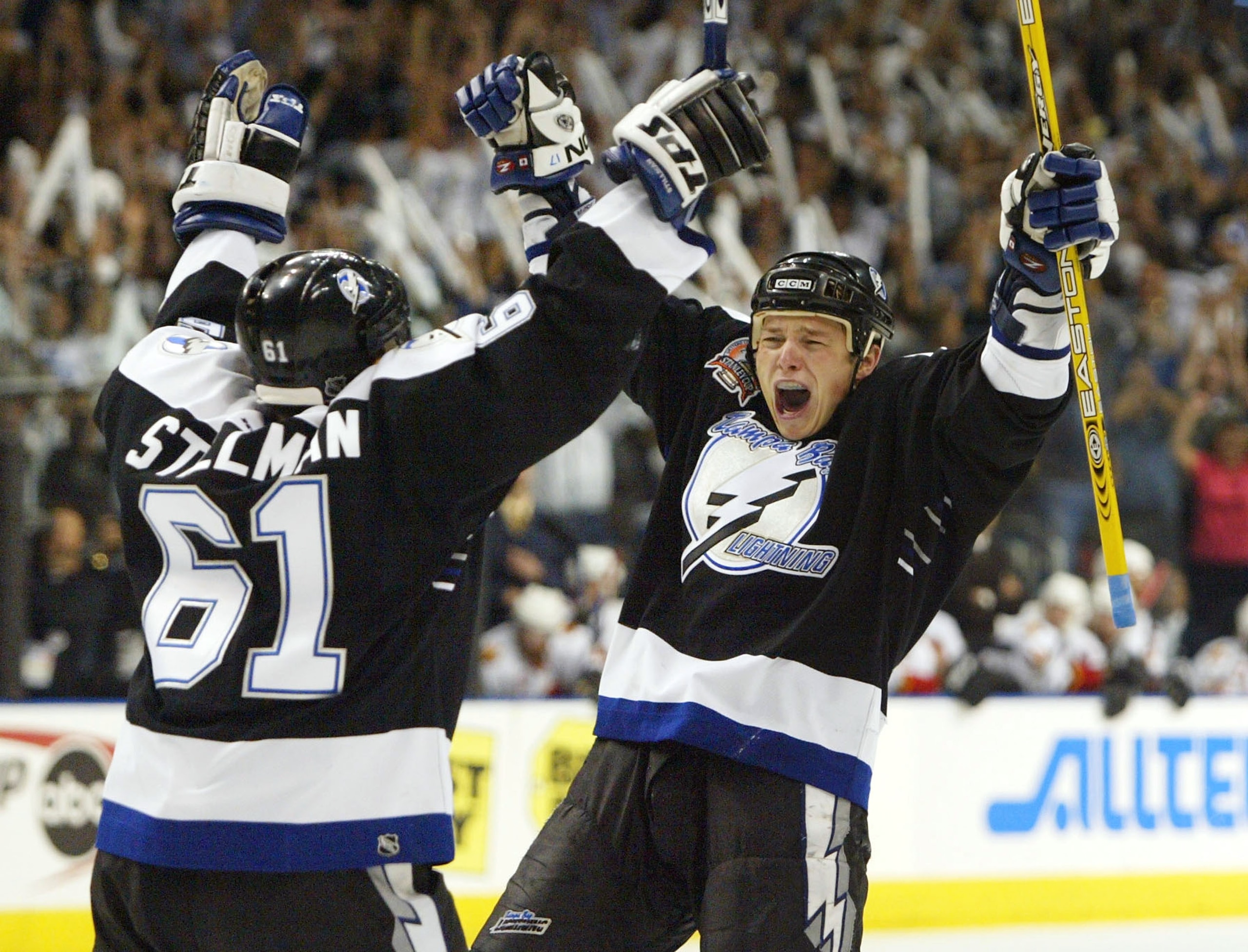 TAMPA, FL - JUNE 7: Ruslan Fedotenko #17 of the Tampa Bay Lightning celebrates with teammate Cory Stillman #61 after scoring the team's second goal against the Calgary Flames in game seven of the NHL Stanley Cup Finals on June 7, 2004 at the St. Pete Tim TAMPA, FL - JUNE 7: Ruslan Fedotenko #17 of the Tampa Bay Lightning celebrates with teammate Cory Stillman #61 after scoring the team's second goal against the Calgary Flames in game seven of the NHL Stanley Cup Finals on June 7, 2004 at the St. Pete Tim