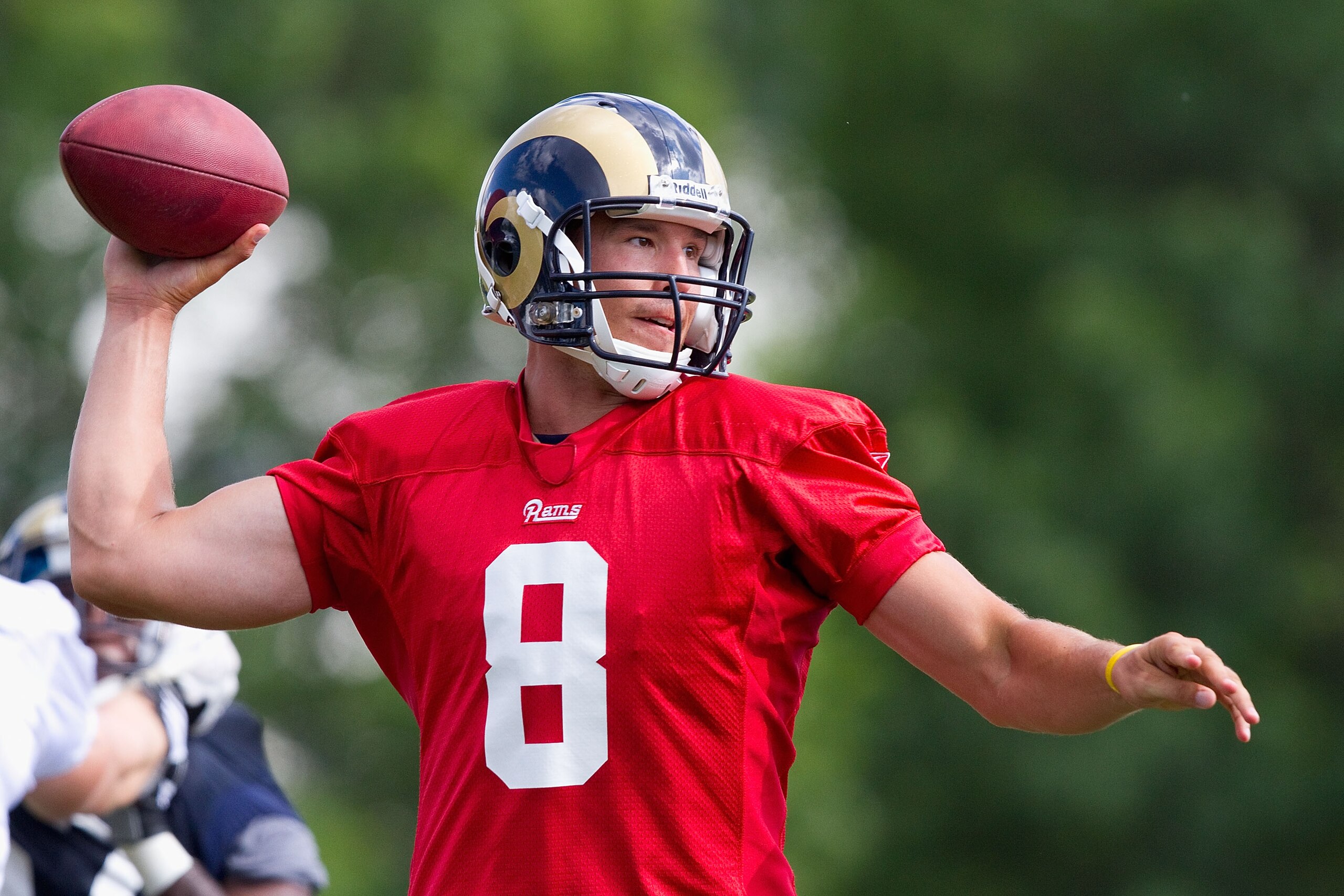 EARTH CITY, MO - JULY 31: Sam Bradford #8 of the St. Louis Rams passes during training camp at the Russell Athletic Training Facility on July 31, 2010 in Earth City, Missouri.  (Photo by Dilip Vishwanat/Getty Images)