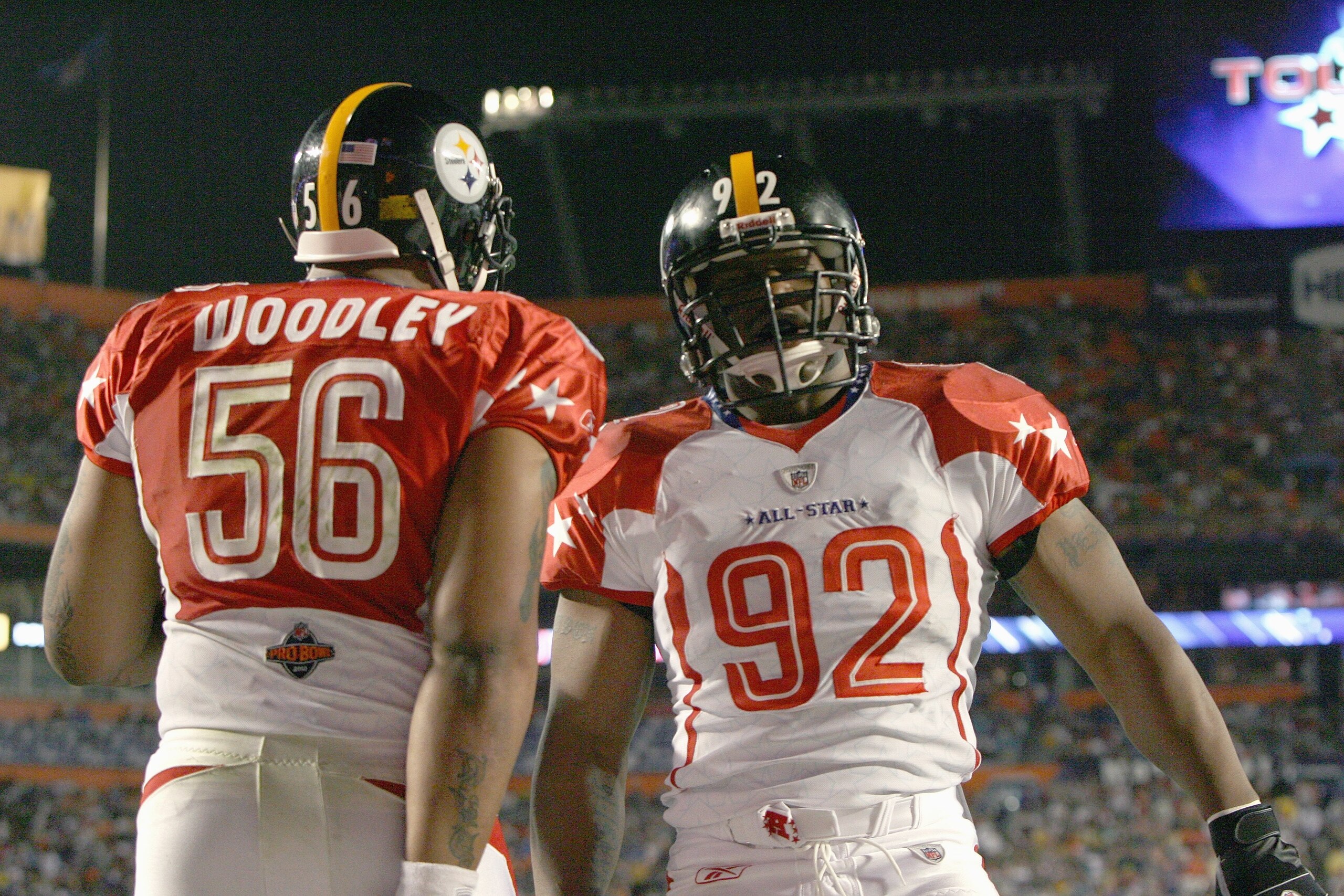MIAMI GARDENS, FL - JANUARY 31: James Harrison #92 of the Pittsburgh Steelers celebrates with  LaMarr Woodley #56 of the Pittsburgh Steelers during the 2010 AFC-NFC Pro Bowl at Sun Life Stadium on January 31, 2010 in Miami Gardens, Florida. (Photo by Doug