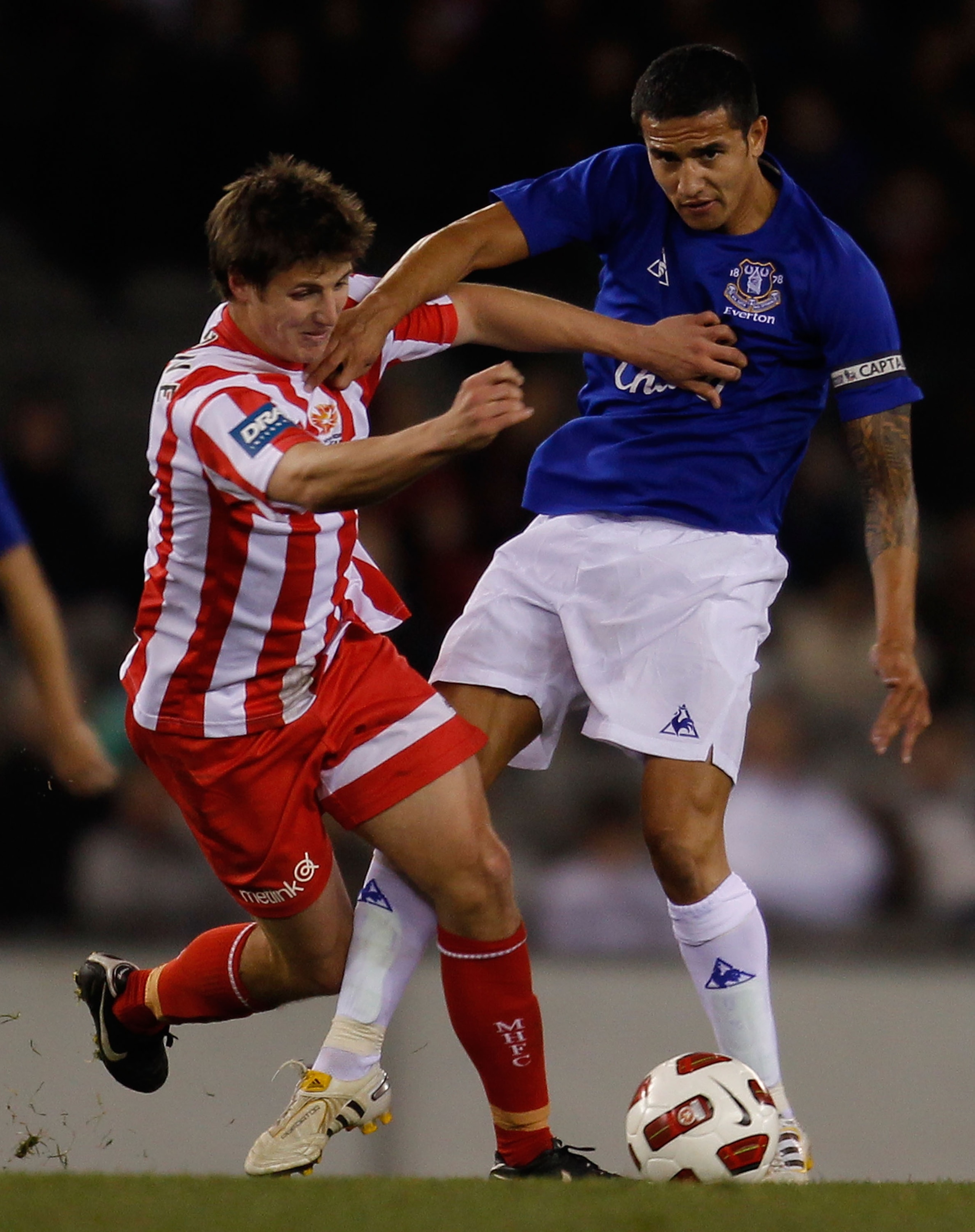 MELBOURNE, AUSTRALIA - JULY 14:  Michael Marrone of Melbourne Heart and Tim Cahill of Everton compete for the ball during a pre-season friendly match between Melbourne Heart and Everton at Etihad Stadium on July 14, 2010 in Melbourne, Australia.  (Photo b