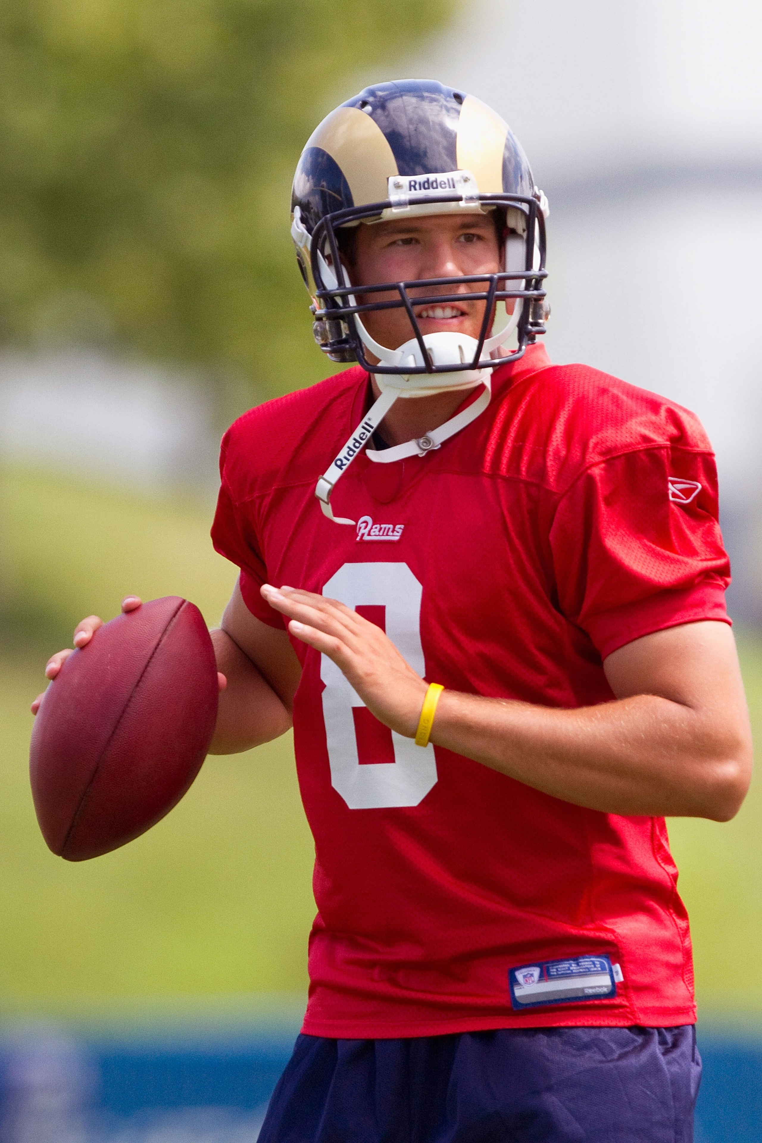 EARTH CITY, MO - JULY 31: Sam Bradford #8 of the St. Louis Rams passes during training camp at the Russell Athletic Training Facility on July 31, 2010 in Earth City, Missouri.  (Photo by Dilip Vishwanat/Getty Images)