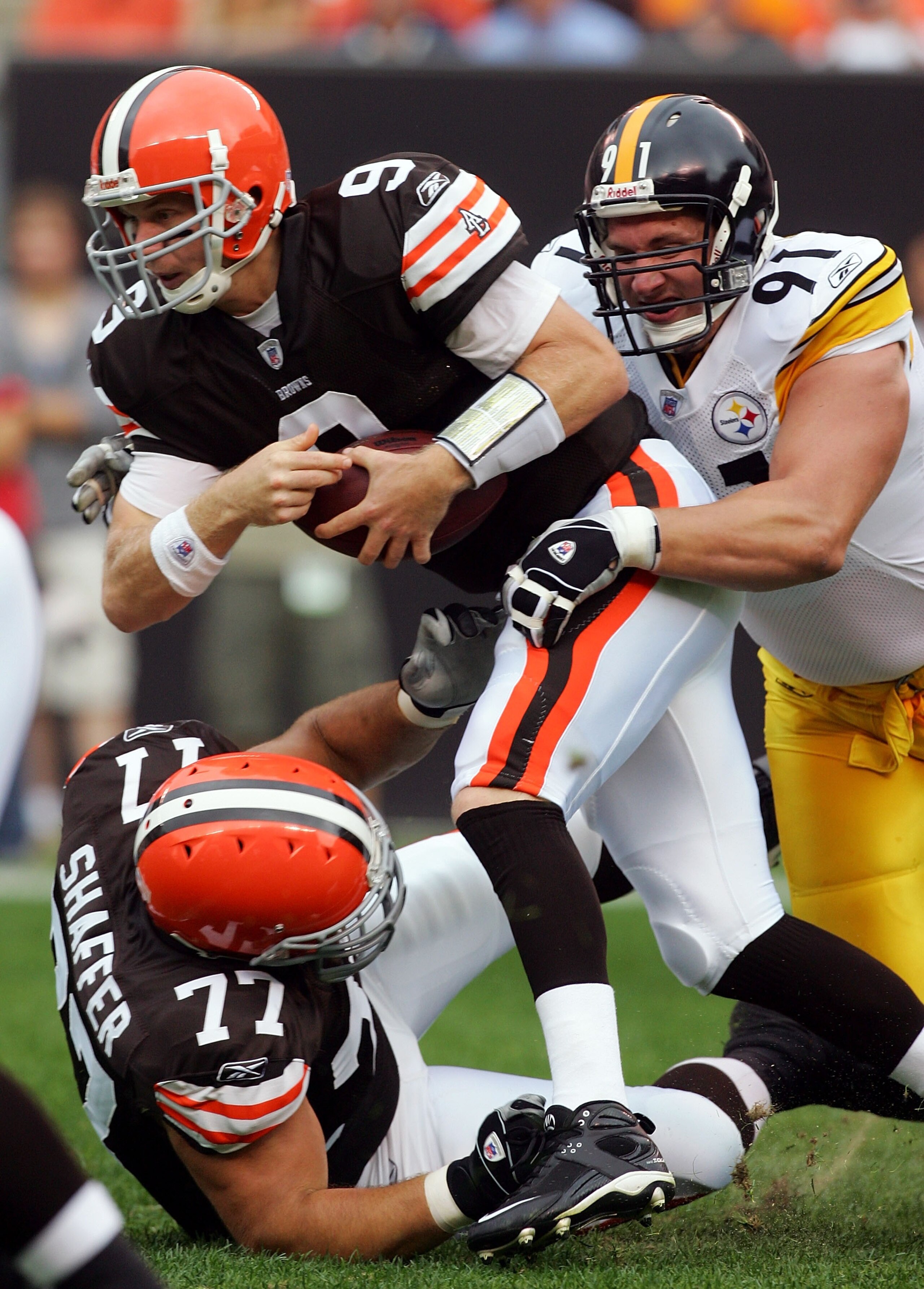 CLEVELAND - SEPTEMBER 9:   Charlie Frye #9 of the Cleveland Browns is sacked by Aaron Smith #91 of the Pittsburgh Steelers during their season opening game at Cleveland Browns Stadium September 9, 2007 in Cleveland, Ohio.  (Photo by Jim McIsaac/Getty Imag