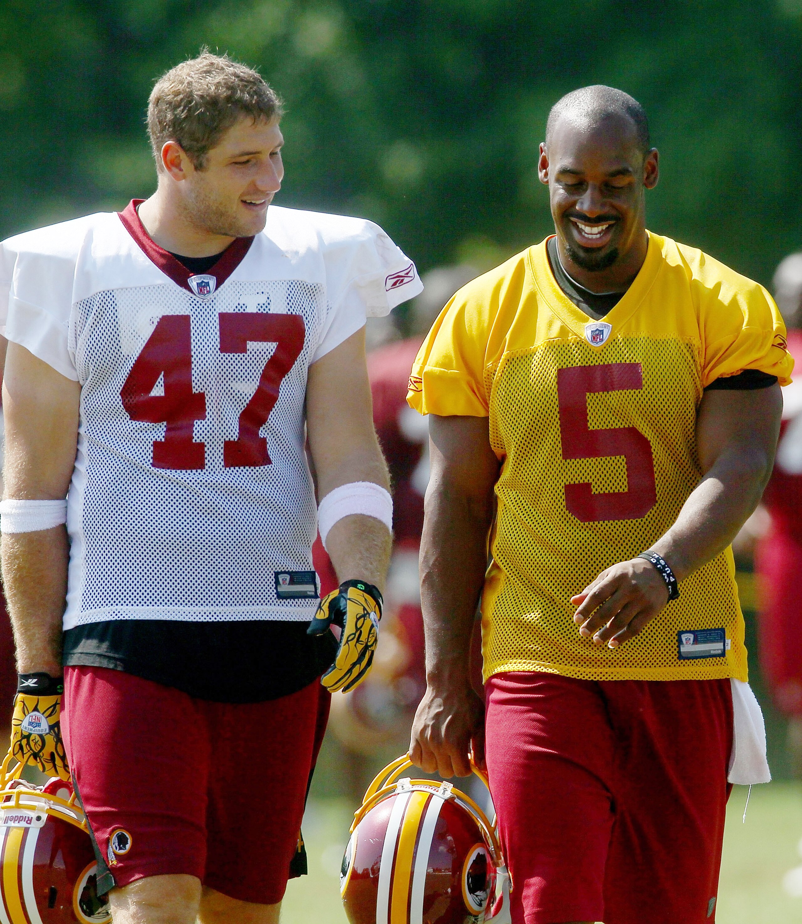 ASHBURN, VA - AUGUST 06:  Quarterback Donovan McNabb #5 of the Washington Redskins and tight end Chris Cooley #47 walk off the field following practice during Redskins training camp on August 6, 2010 in Ashburn, Virginia.  (Photo by Win McNamee/Getty Imag