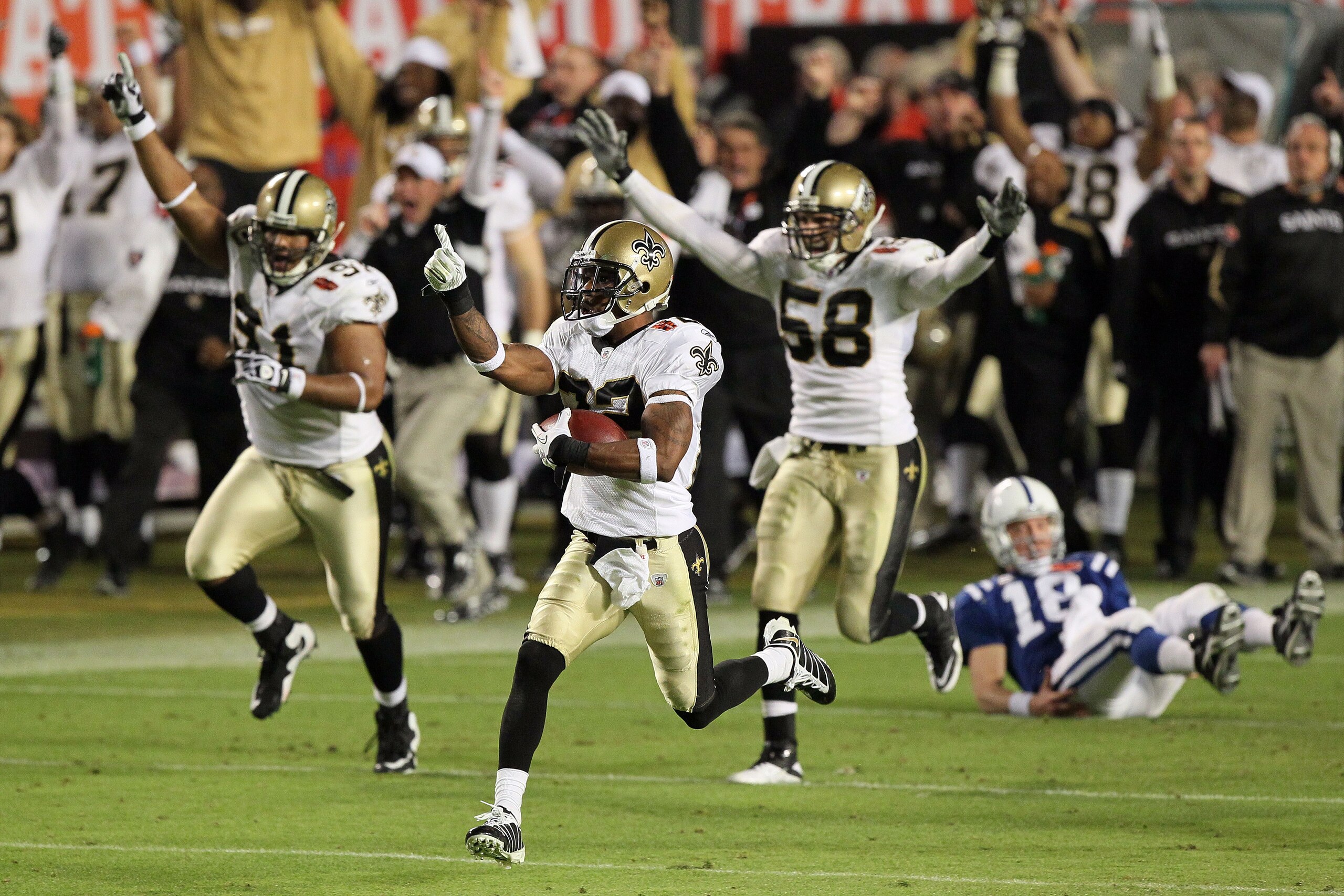 MIAMI GARDENS, FL - FEBRUARY 07: Tracy Porter #22 of the New Orleans Saints intercepts a ball and thrown by Peyton Manning #18 of the Indianapolis Colts and returns it for a touchdown in the fourth quarter during Super Bowl XLIV on February 7, 2010 at Sun