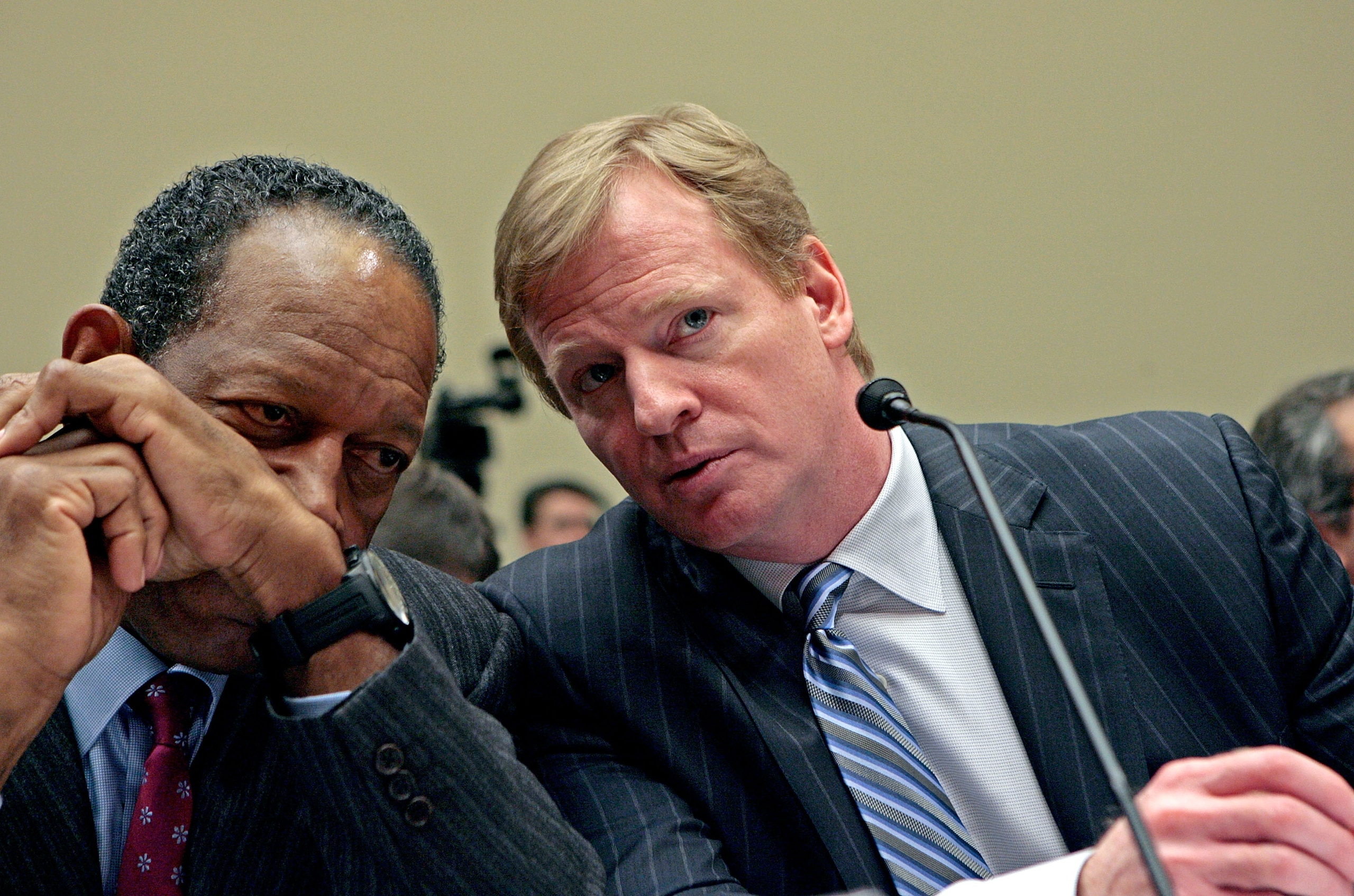 WASHINGTON - FEBRUARY 27: National Football League Players Association Executive Director Gene Upshaw (L) and National Football League Commissioner Roger Goodell talk while testifying before the US House Subcommittee on Commerce, Trade and Consumer Protec