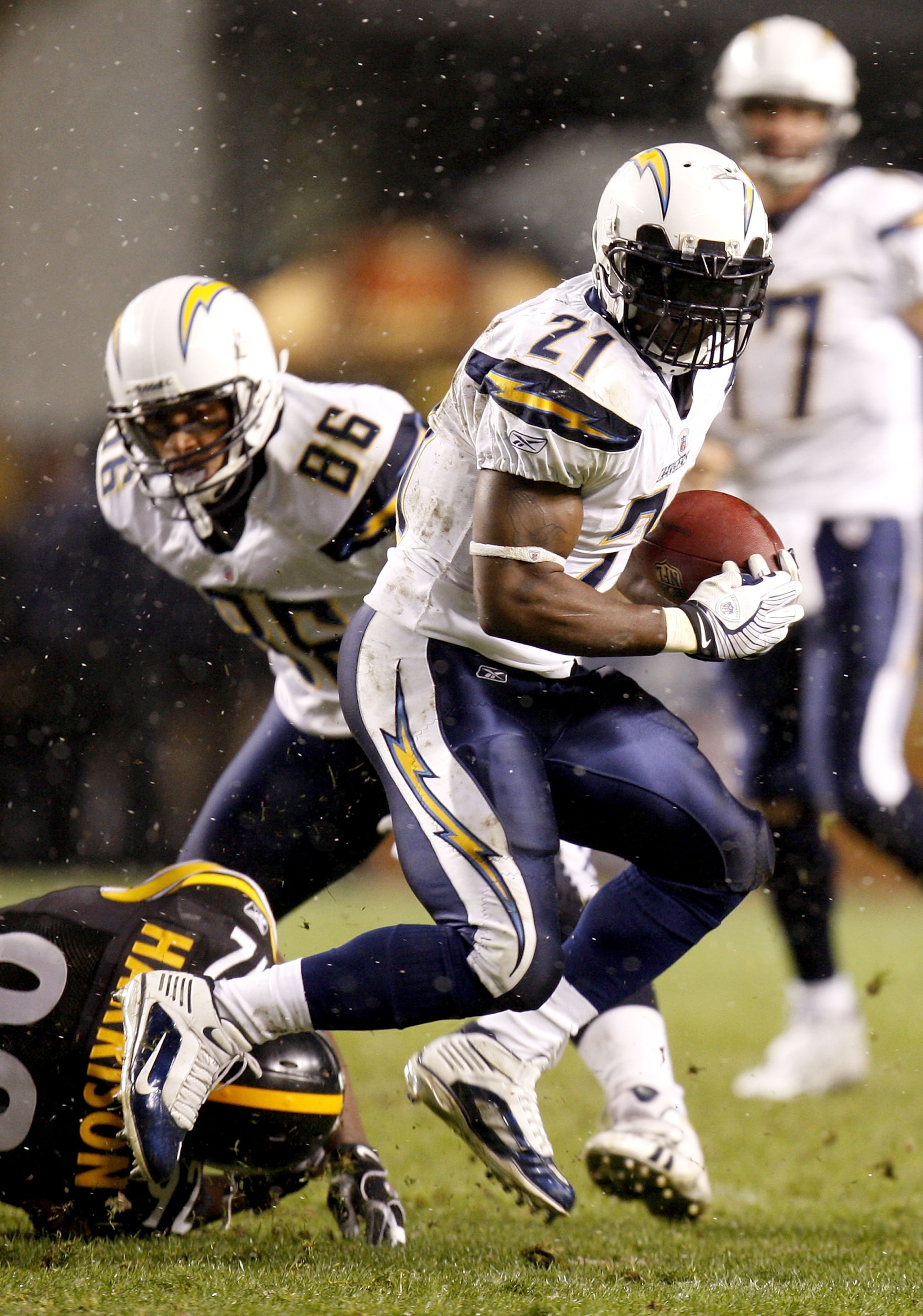 PITTSBURGH - NOVEMBER 16: LaDanian Tomlinson #21 of the San Diego Chargers looks for exta yards after getting past James Harrison #92 of the Pittsburgh Steelers during the second quarter on November 16, 2008 at Heinz Field in Pittsburgh, Pennsylvania.  (P