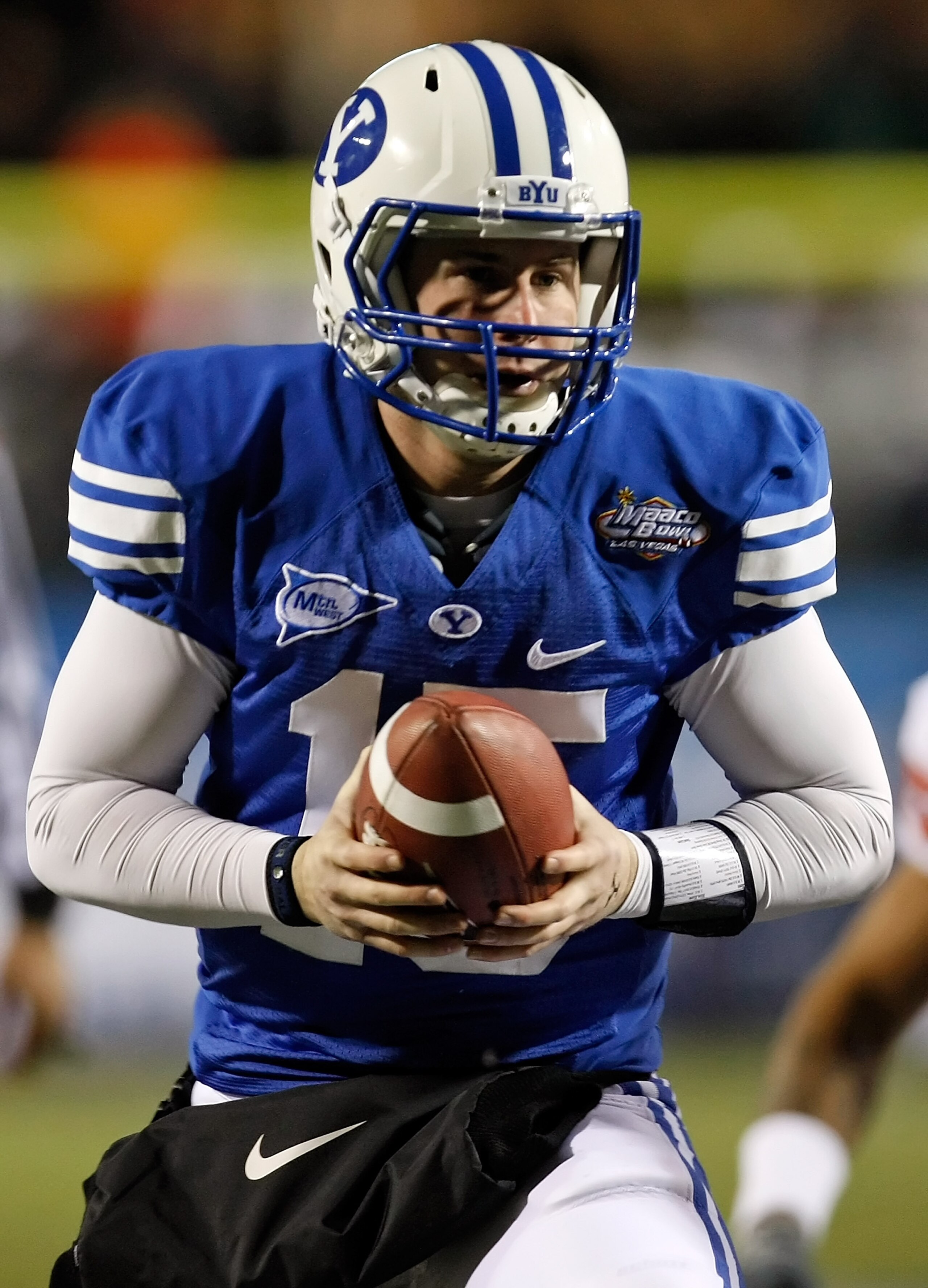 LAS VEGAS - DECEMBER 22:  Quarterback Max Hall #15 of the Brigham Young University Cougars looks to hand the ball off against the Oregon State Beavers during the MAACO Las Vegas Bowl at Sam Boyd Stadium December 22, 2009 in Las Vegas, Nevada. Hall was nam