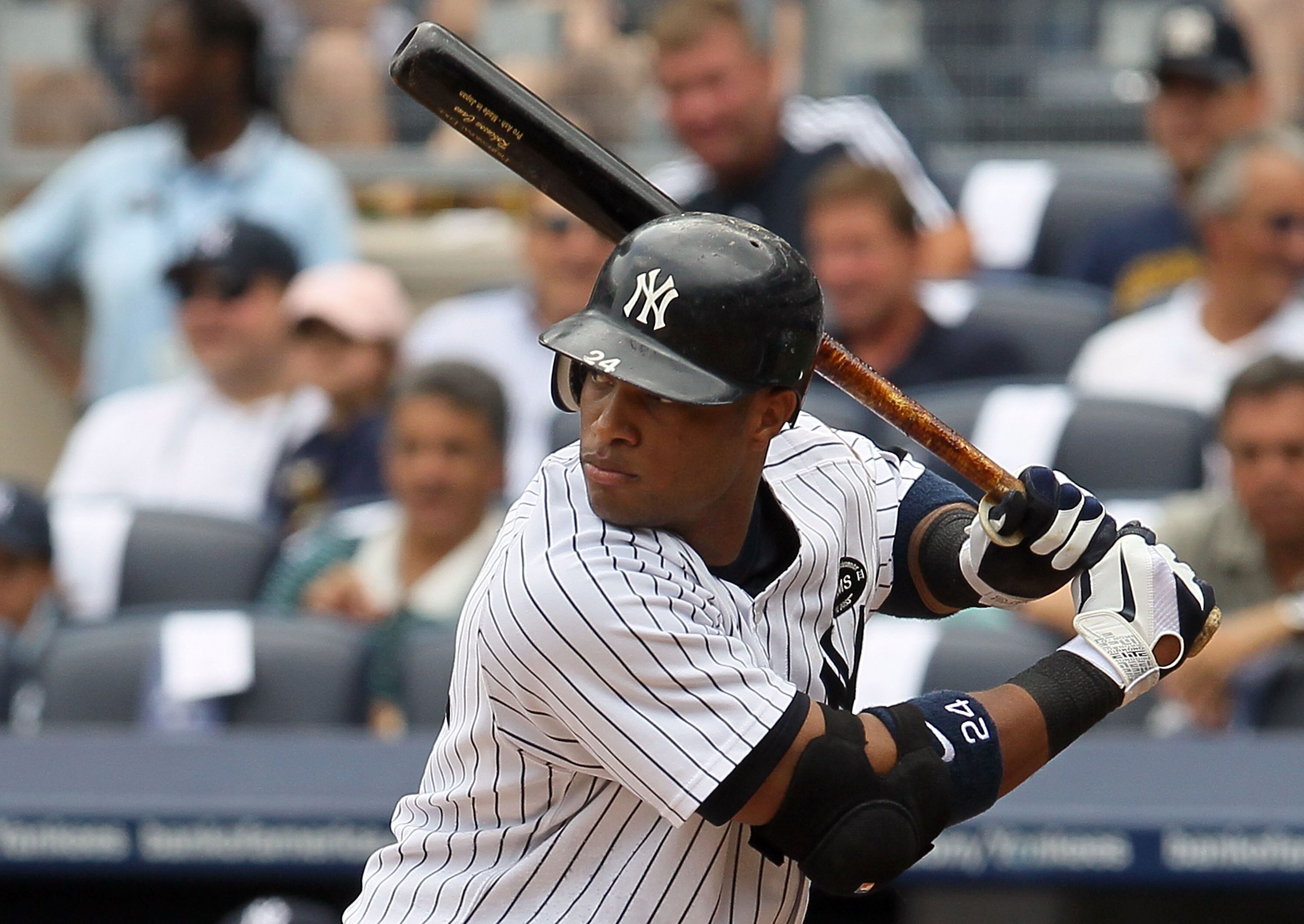 NEW YORK - AUGUST 04:  Robinson Cano #24 of the New York Yankees bats against the Toronto Blue Jays on August 4, 2010 at Yankee Stadium in the Bronx borough of New York City.  (Photo by Jim McIsaac/Getty Images)