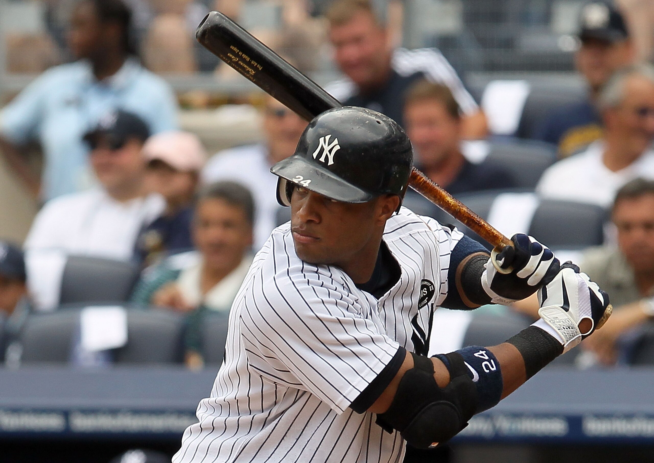 NEW YORK - AUGUST 04:  Robinson Cano #24 of the New York Yankees bats against the Toronto Blue Jays on August 4, 2010 at Yankee Stadium in the Bronx borough of New York City.  (Photo by Jim McIsaac/Getty Images)