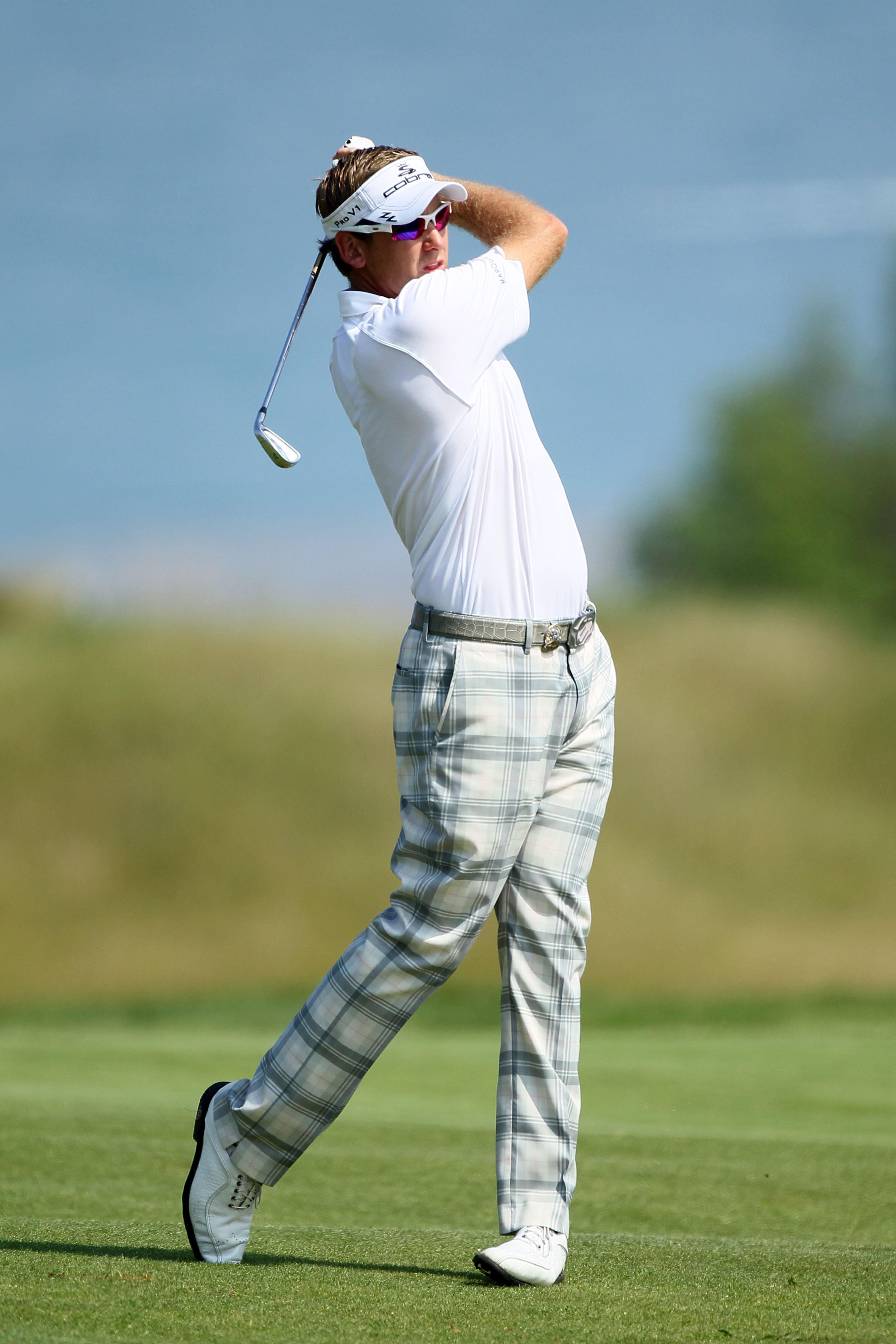 KOHLER, WI - AUGUST 11:  Ian Poulter of England hits a shot during a practice round prior to the start of the 92nd PGA Championship on the Straits Course at Whistling Straits on August 11, 2010 in Kohler, Wisconsin.  (Photo by Andy Lyons/Getty Images)