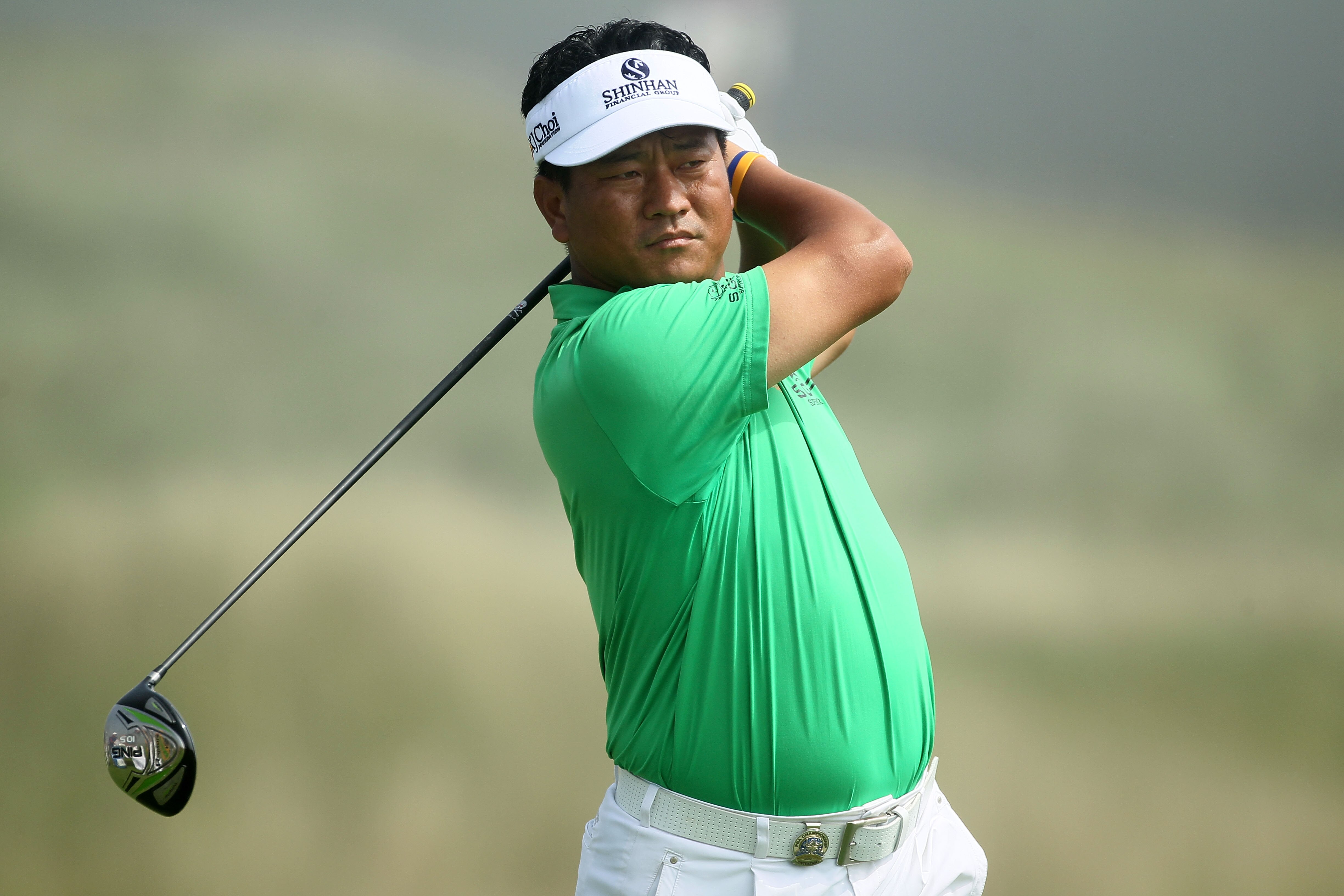 KOHLER, WI - AUGUST 12:  K.J. Choi of South Korea watches his tee shot on the second hole during the first round of the 92nd PGA Championship on the Straits Course at Whistling Straits on August 12, 2010 in Kohler, Wisconsin.  (Photo by Andy Lyons/Getty I