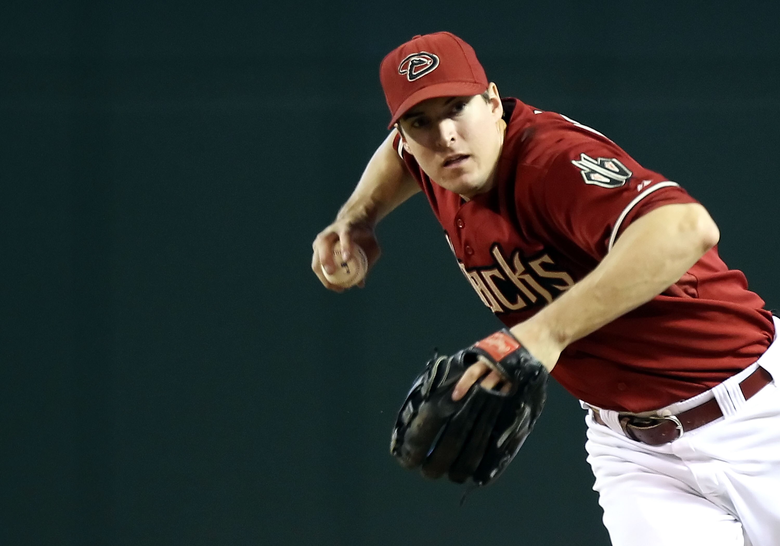 PHOENIX - JULY 11:  Infielder Kelly Johnson #2 of the Arizona Diamondbacks fields a ground ball during the Major League Baseball game against the Florida Marlins at Chase Field on July 11, 2010 in Phoenix, Arizona.  The Marlins defeated the Diamondbacks 2