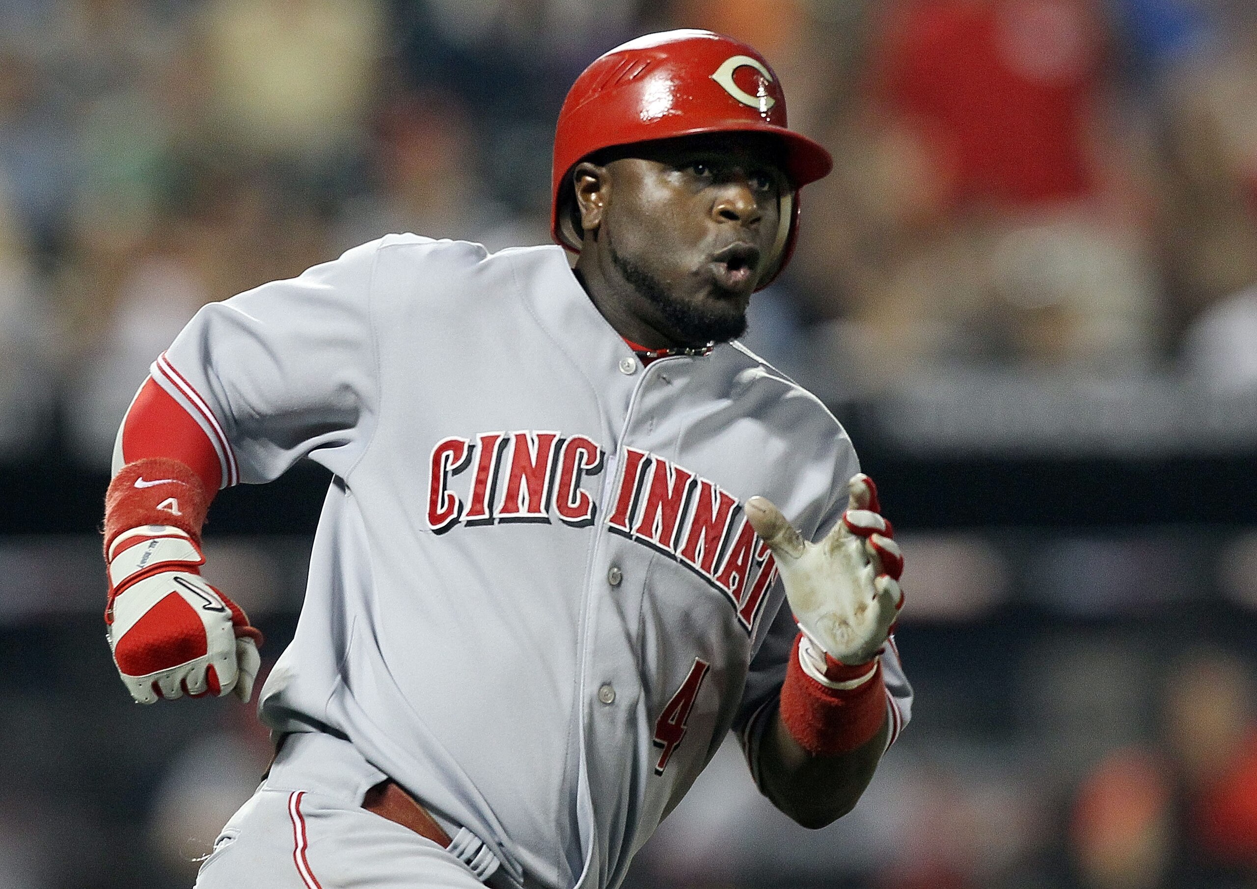 NEW YORK - JULY 07:  Brandon Phillips #4 of the Cincinnati Reds runs the bases after hitting a seventh inning RBI double against the New York Mets on July 7, 2010 at Citi Field in the Flushing neighborhood of the Queens borough of New York City.  (Photo b
