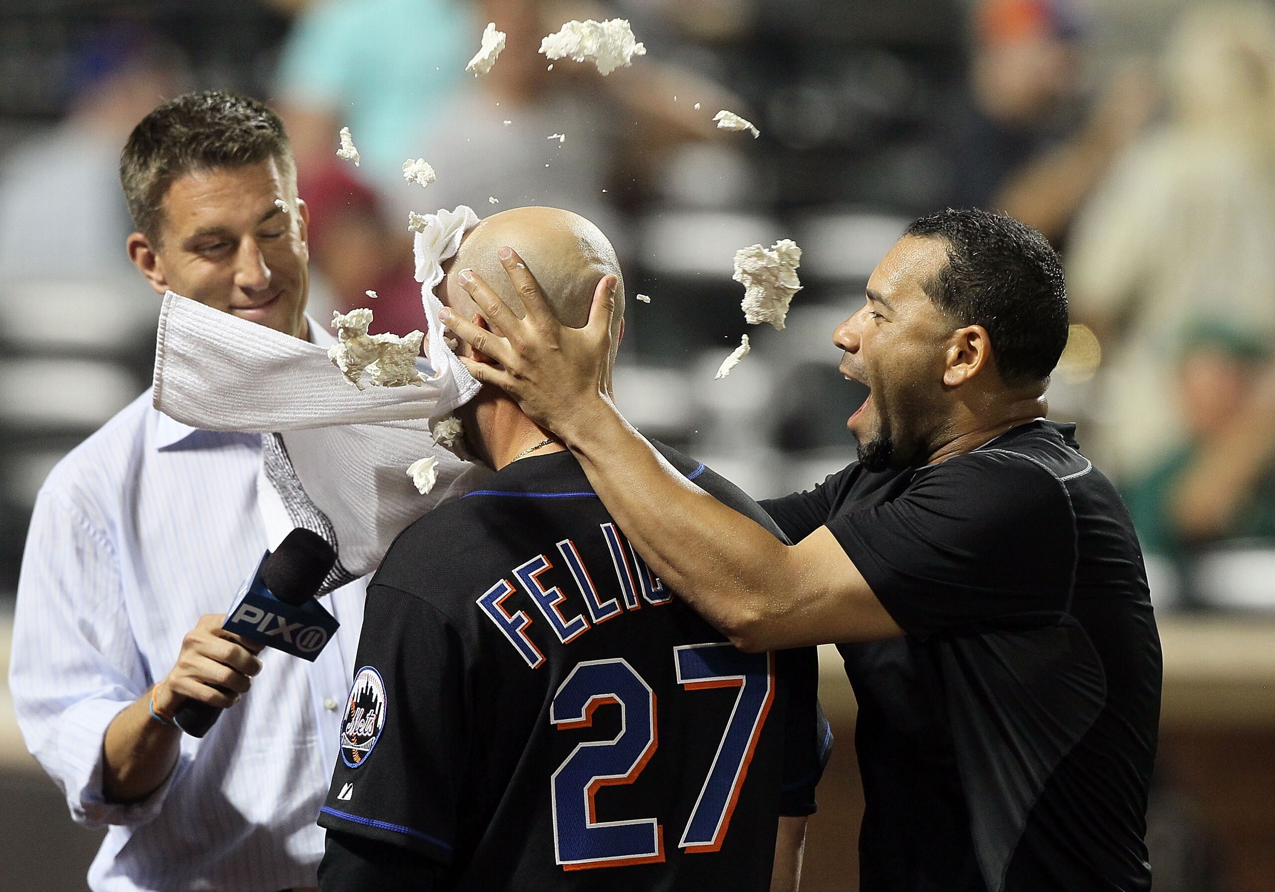 NEW YORK - JULY 31:  Jesus Feliciano #27 of the New York Mets gets a shaving cream pie in the face in celebration from teammate Pedro Feliciano #25 after scoring the winning run against the Arizona Diamondbacks in the ninth inning on July 31, 2010 at Citi