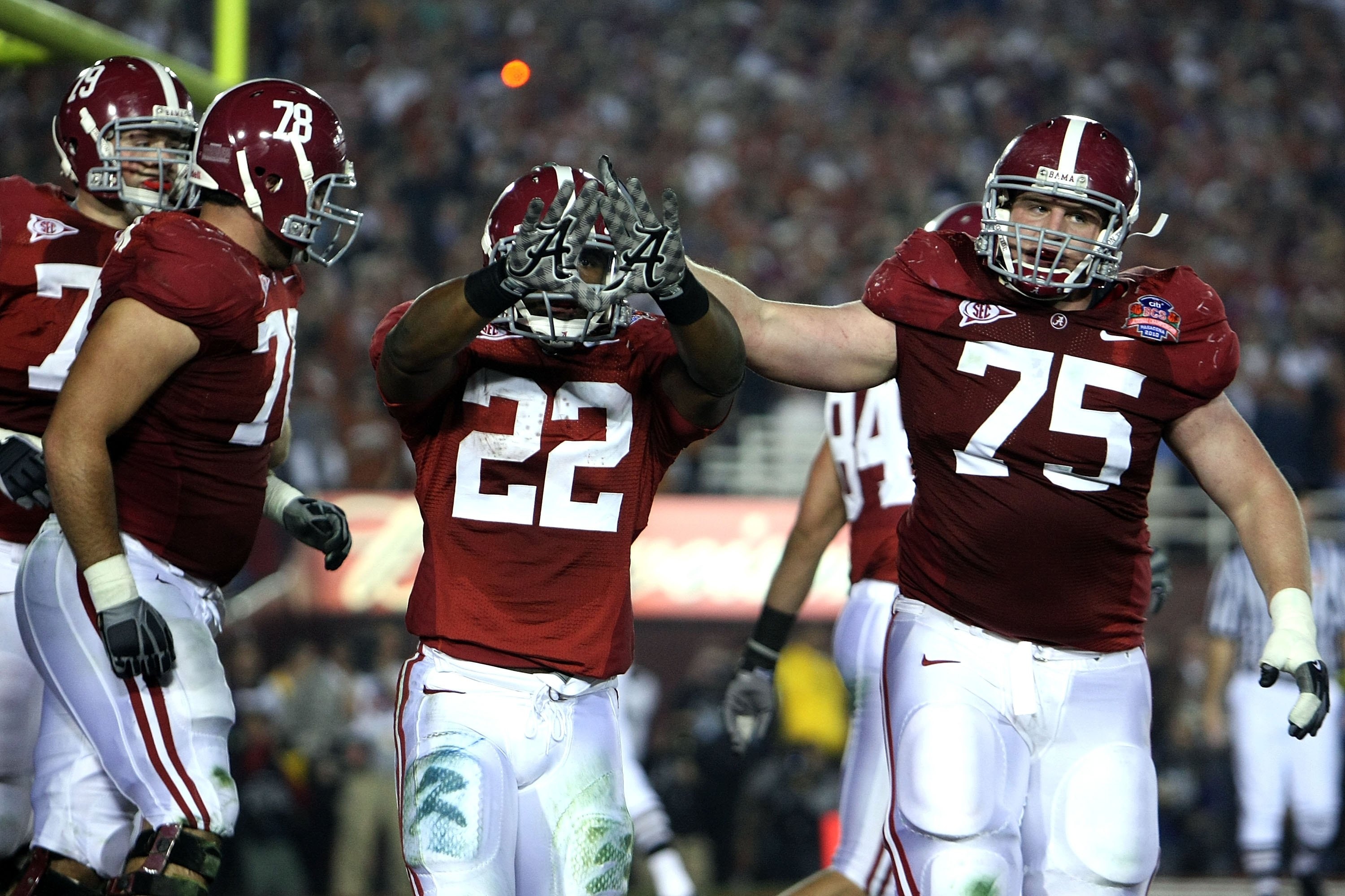 PASADENA, CA - JANUARY 07:  Running back Mark Ingram #22 of the Alabama Crimson Tide celebrates a touchdown with teammates against the Texas Longhorns in the second quarter of the Citi BCS National Championship game at the Rose Bowl on January 7, 2010 in