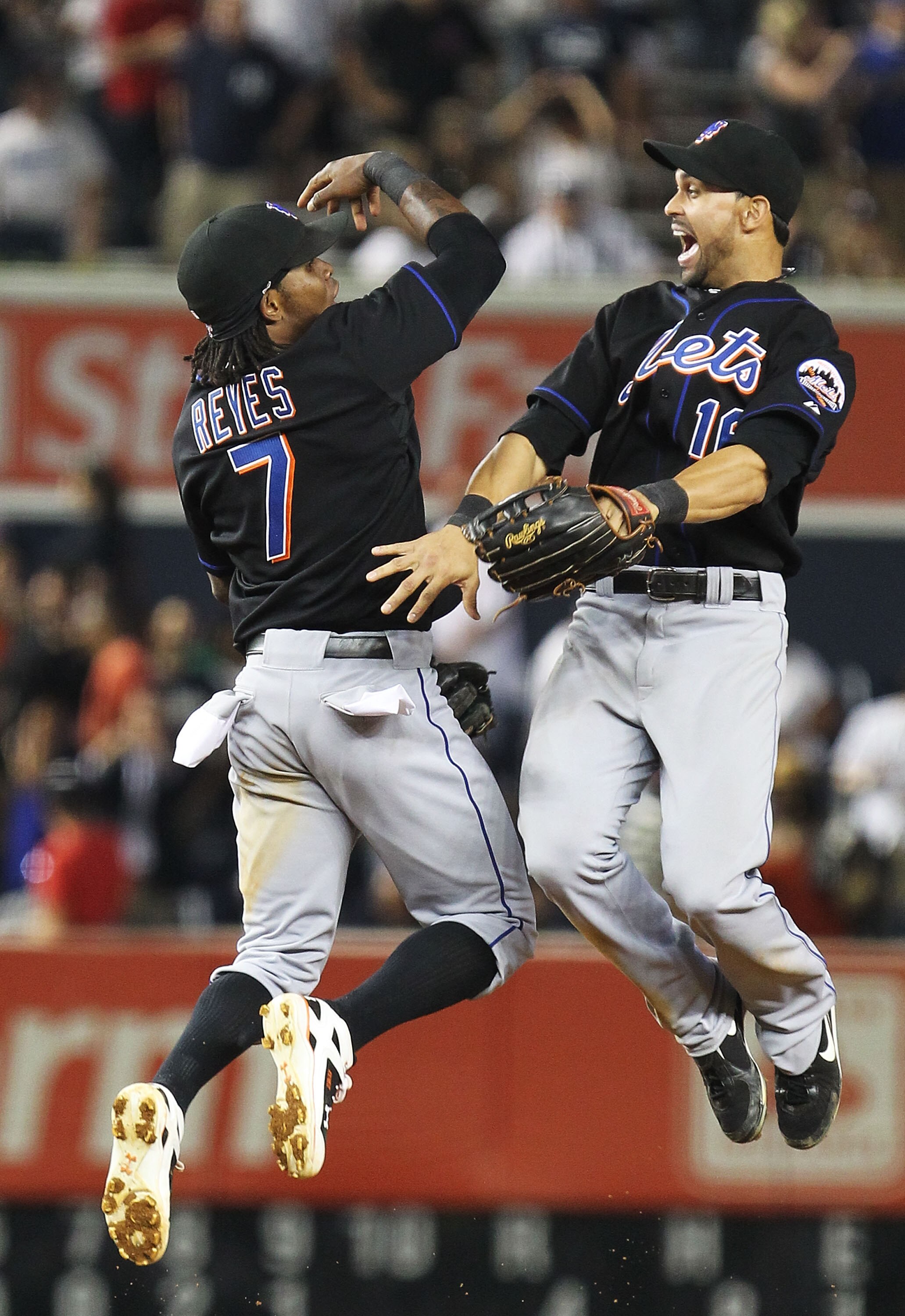 NEW YORK - JUNE 18:  Jose Reyes #7 and Angel Pagan #16 of the New York Mets celebrate a 4-0 win against the New York Yankees on June 18, 2010 at Yankee Stadium in the Bronx borough of New York City.  (Photo by Al Bello/Getty Images)