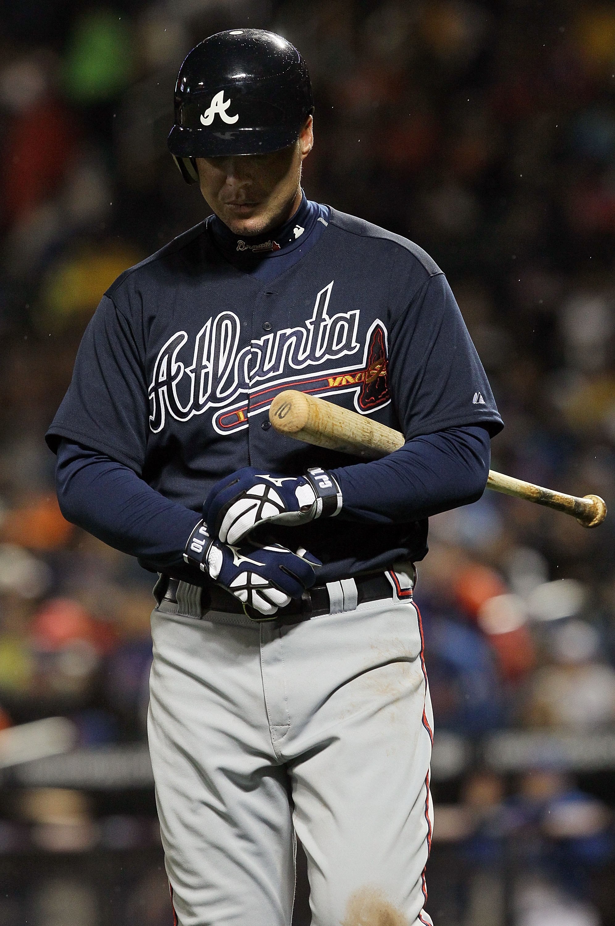 NEW YORK - APRIL 25:  Chipper Jones #10 of the Atlanta Braves walks back to the dugout after striking out in the fifth inning against the New York Mets on April 25, 2010 at Citi Field in the Flushing neighborhood of the Queens borough of New York City.  (