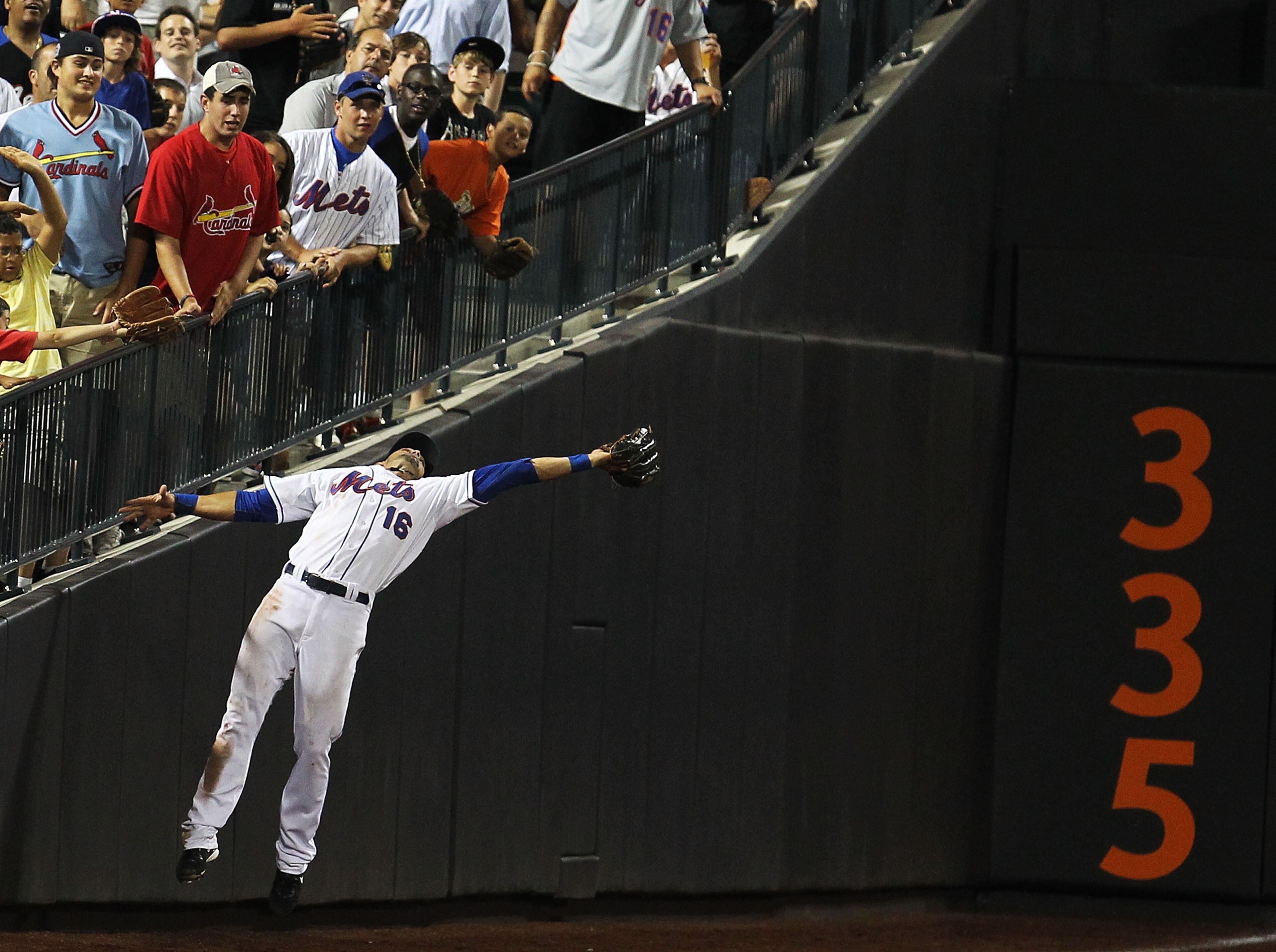 NEW YORK - JULY 27:  Angel Pagan #16 of the New York Mets makes a catch that was hit by Albert Pujols #5 of the St. Louis Cardinals during their game on July 27, 2010 at Citi Field in the Flushing neighborhood of the Queens borough of New York City.  (Pho