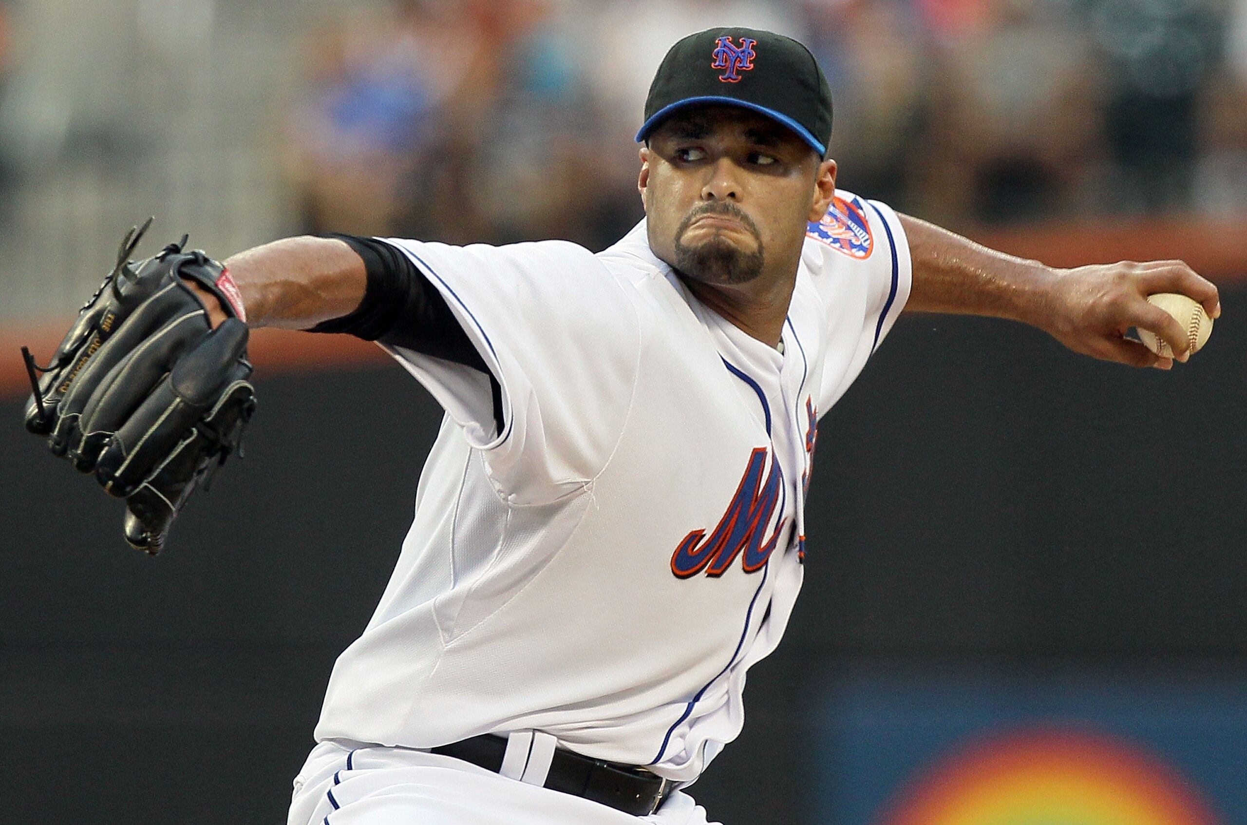 NEW YORK - JULY 06:  Johan Santana #57 of the New York Mets delivers a pitch against the Cincinnati Reds on July 6, 2010 at Citi Field in the Flushing neighborhood of the Queens borough of New York City.  (Photo by Jim McIsaac/Getty Images)