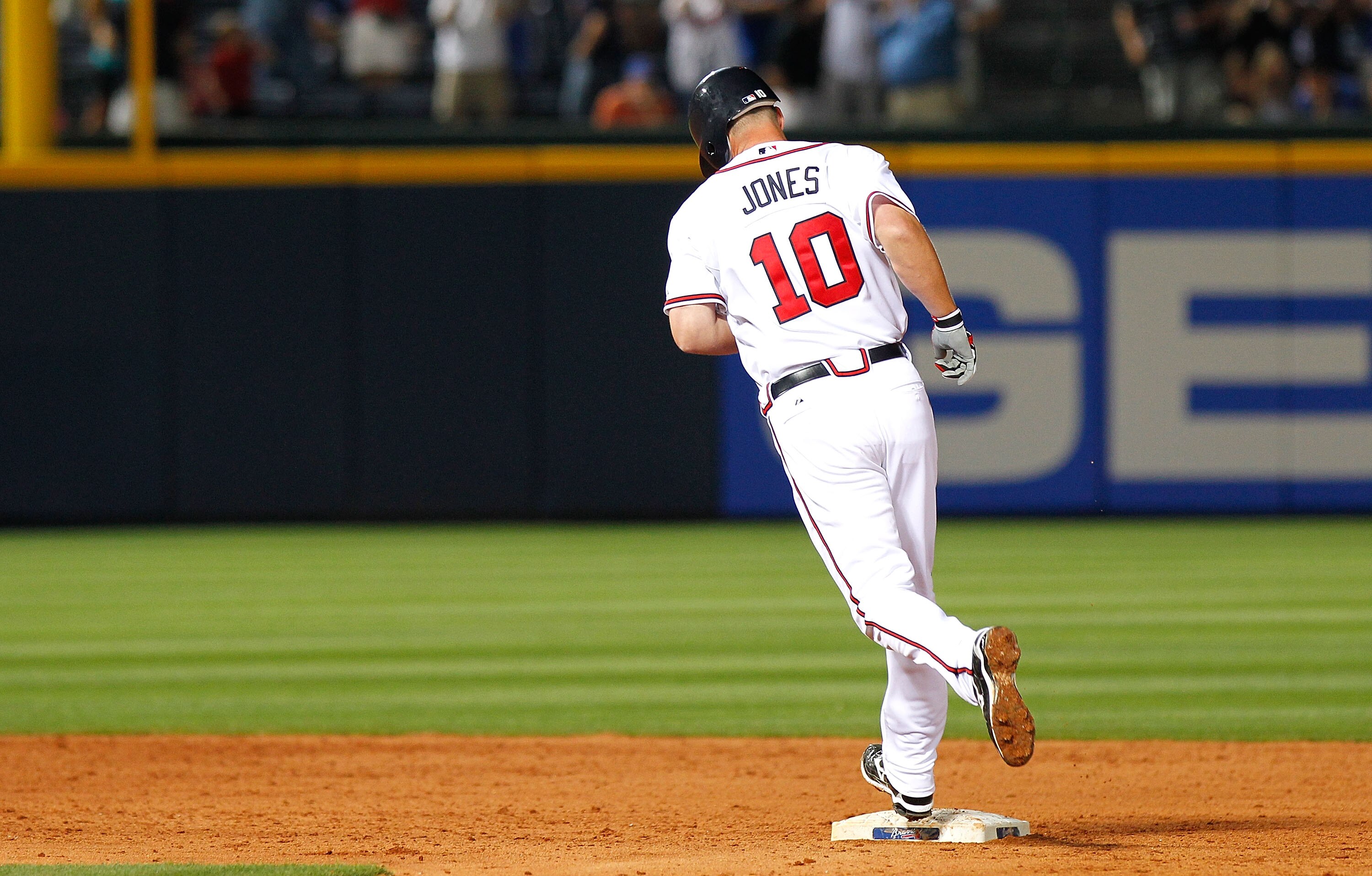 ATLANTA - APRIL 07:  Chipper Jones #10 of the Atlanta Braves rounds second base after hitting a two-run homer in the bottom of the eighth inning to give the Braves a 3-2 lead over the Chicago Cubs at Turner Field on April 7, 2010 in Atlanta, Georgia.  (Ph