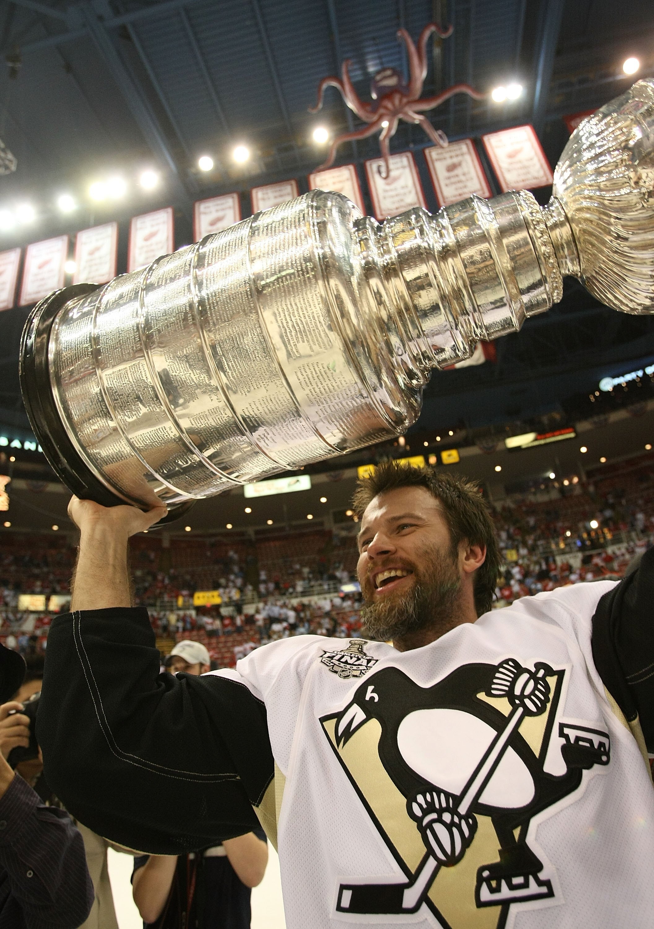 DETROIT - JUNE 12: Petr Sykora #17 of the Pittsburgh Penguins holds the Stanley Cup following the Penguins victory over the Detroit Red Wings in Game Seven of the 2009 NHL Stanley Cup Finals at Joe Louis Arena on June 12, 2009 in Detroit, Michigan.  (Phot