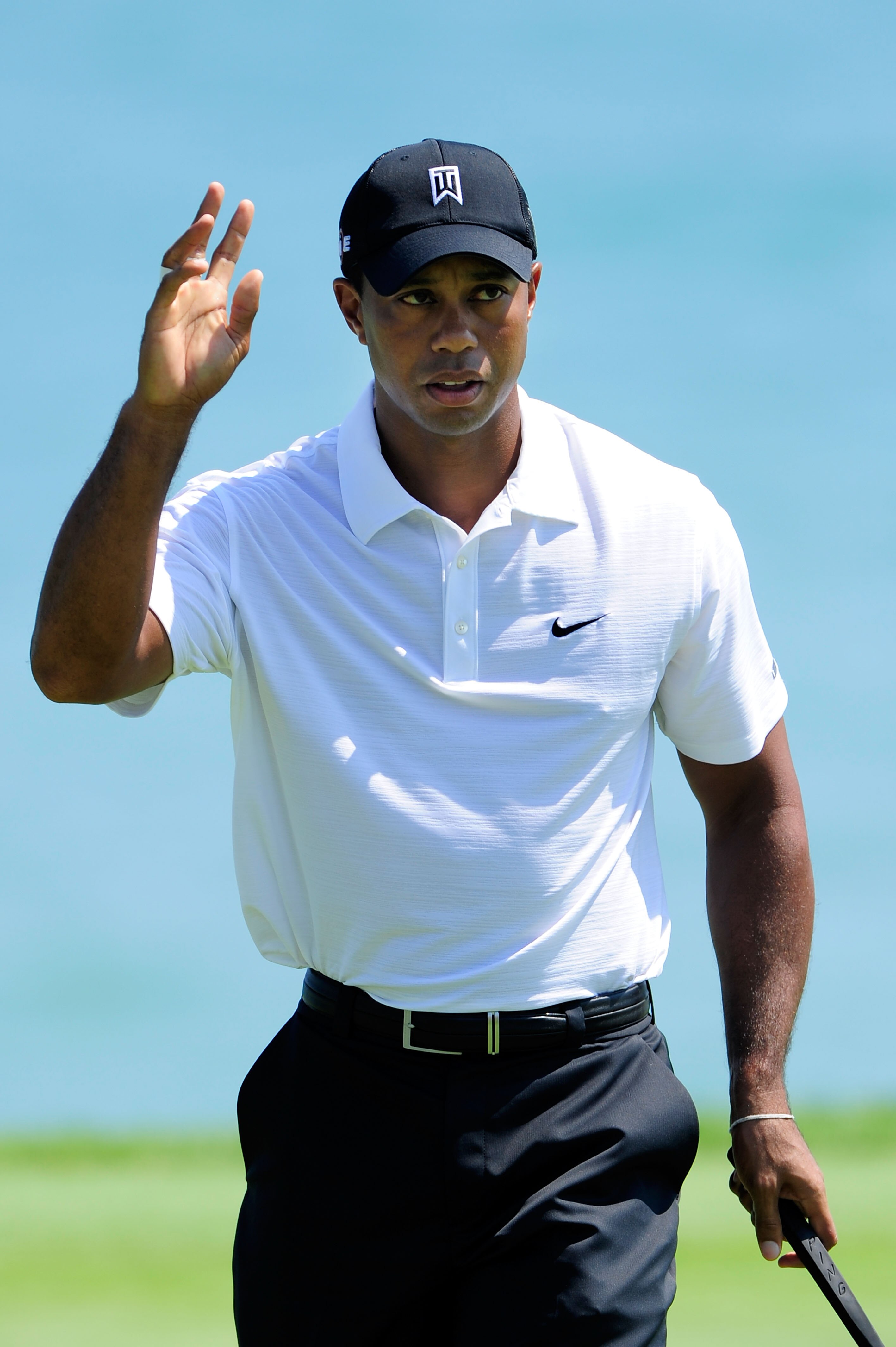 KOHLER, WI - AUGUST 12:  Tiger Woods celebrates making birdie on the 13th hole during the first round of the 92nd PGA Championship on the Straits Course at Whistling Straits on August 12, 2010 in Kohler, Wisconsin.  (Photo by Stuart Franklin/Getty Images)