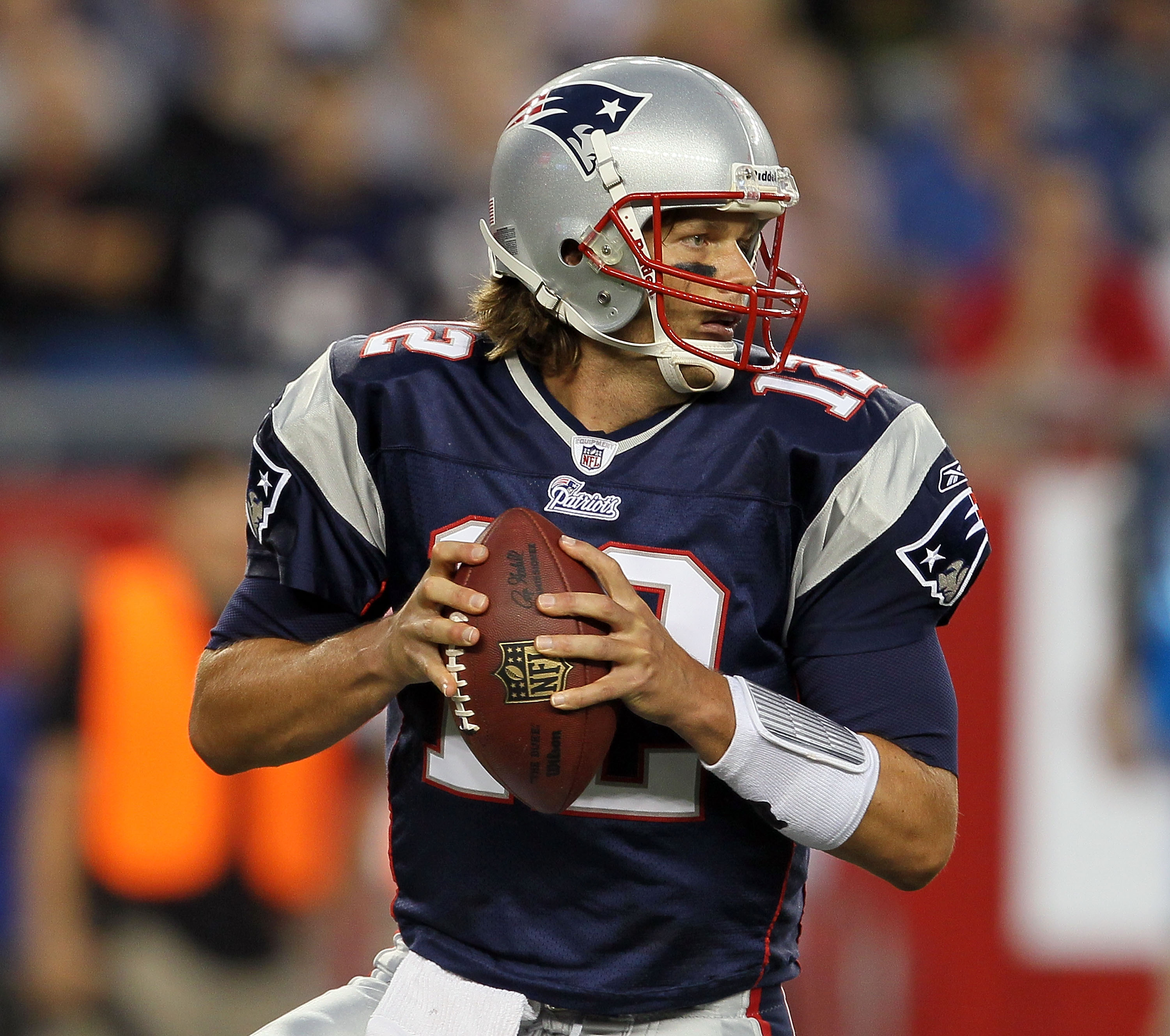 FOXBORO, MA - AUGUST 12: Tom Brady # 12 of the New England Patriots looks to pass during the preseason game against the New Orleans Saints at Gillette Stadium on August 12, 2010 in Foxboro, Massachusetts. (Photo by Jim Rogash/Getty Images)