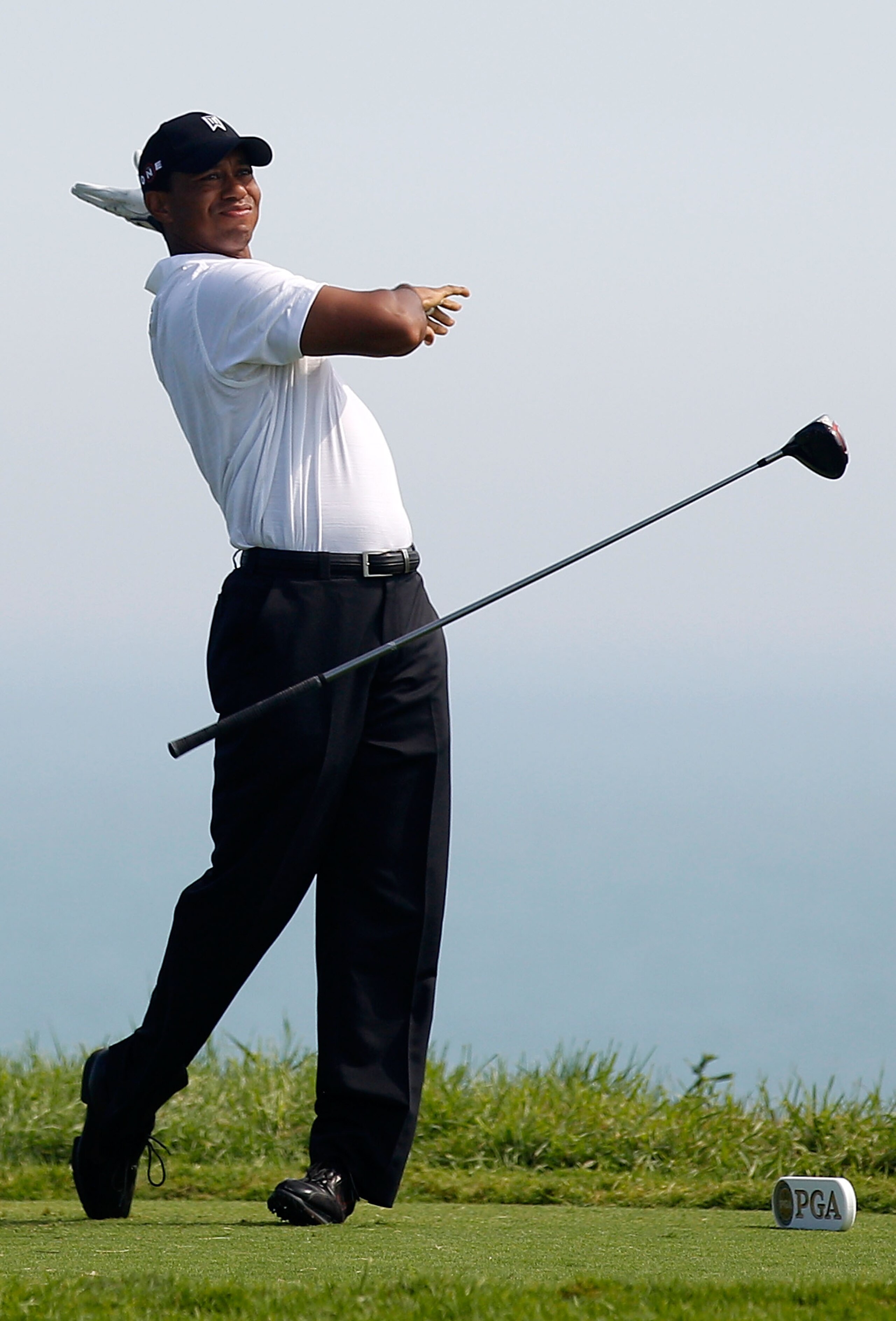 KOHLER, WI - AUGUST 12:  Tiger Woods reacts to his tee shot on the fifth hole during the first round of the 92nd PGA Championship on the Straits Course at Whistling Straits on August 12, 2010 in Kohler, Wisconsin.  (Photo by Chris Graythen/Getty Images)