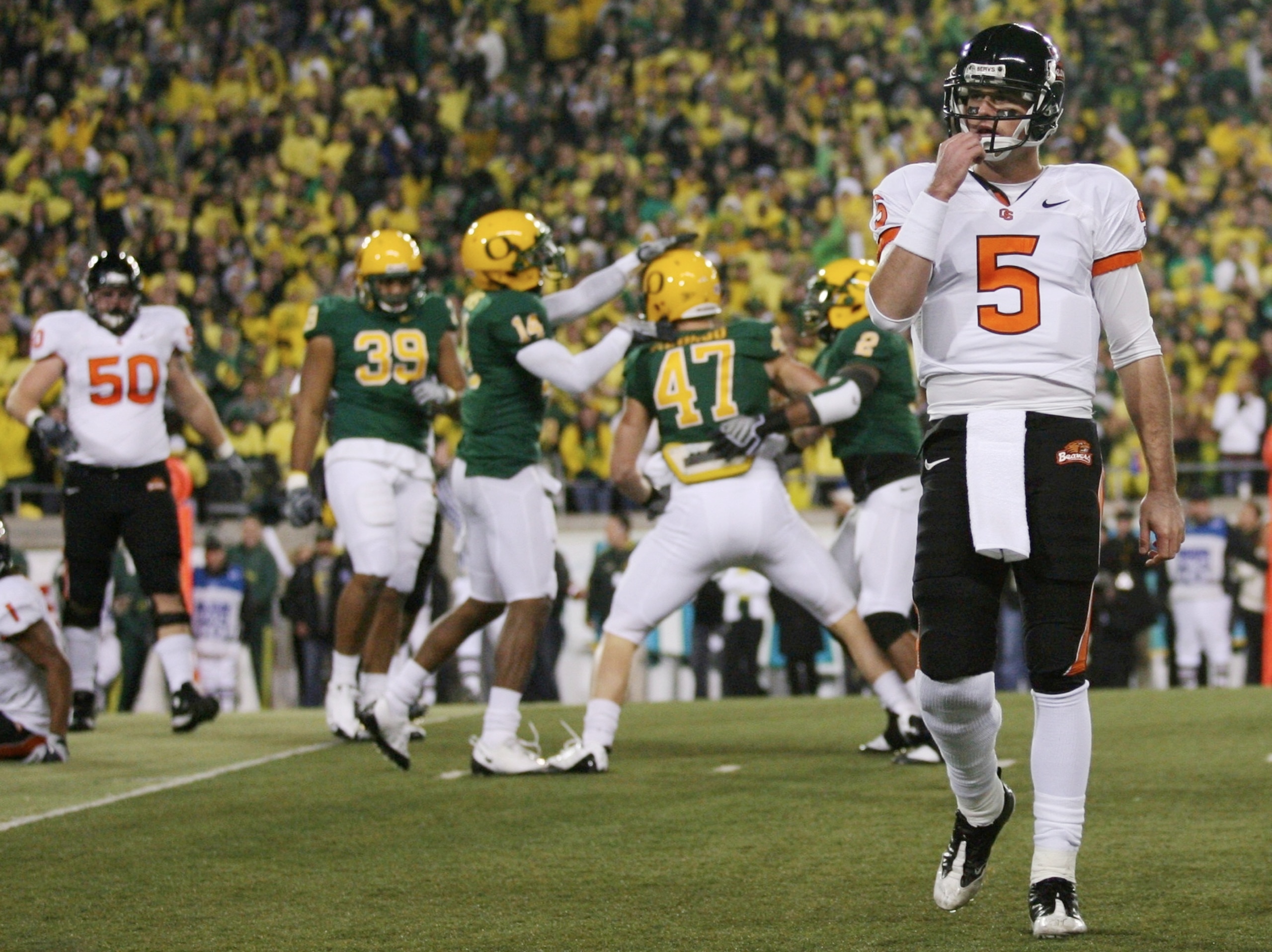 EUGENE,OR - DECEMBER 03: Quarterback Sean Canfield #47 of the Oregon State Beavers walks off the field after teammate Jacquizz Rodgers #1 is tackled by Kiko Alonso #47 of the Oregon Ducks during the second quarter of the game at Autzen Stadium on December