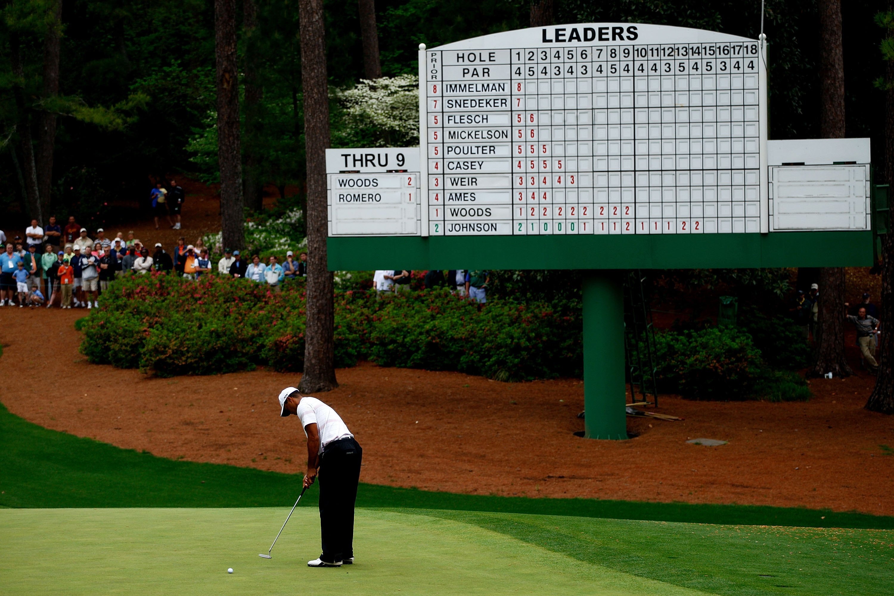 AUGUSTA, GA - APRIL 12:  Tiger Woods plays a shot in front of a leaderboard on the 10th hole during the third round of the 2008 Masters Tournament at Augusta National Golf Club on April 12, 2008 in Augusta, Georgia.  (Photo by Jamie Squire/Getty Images)