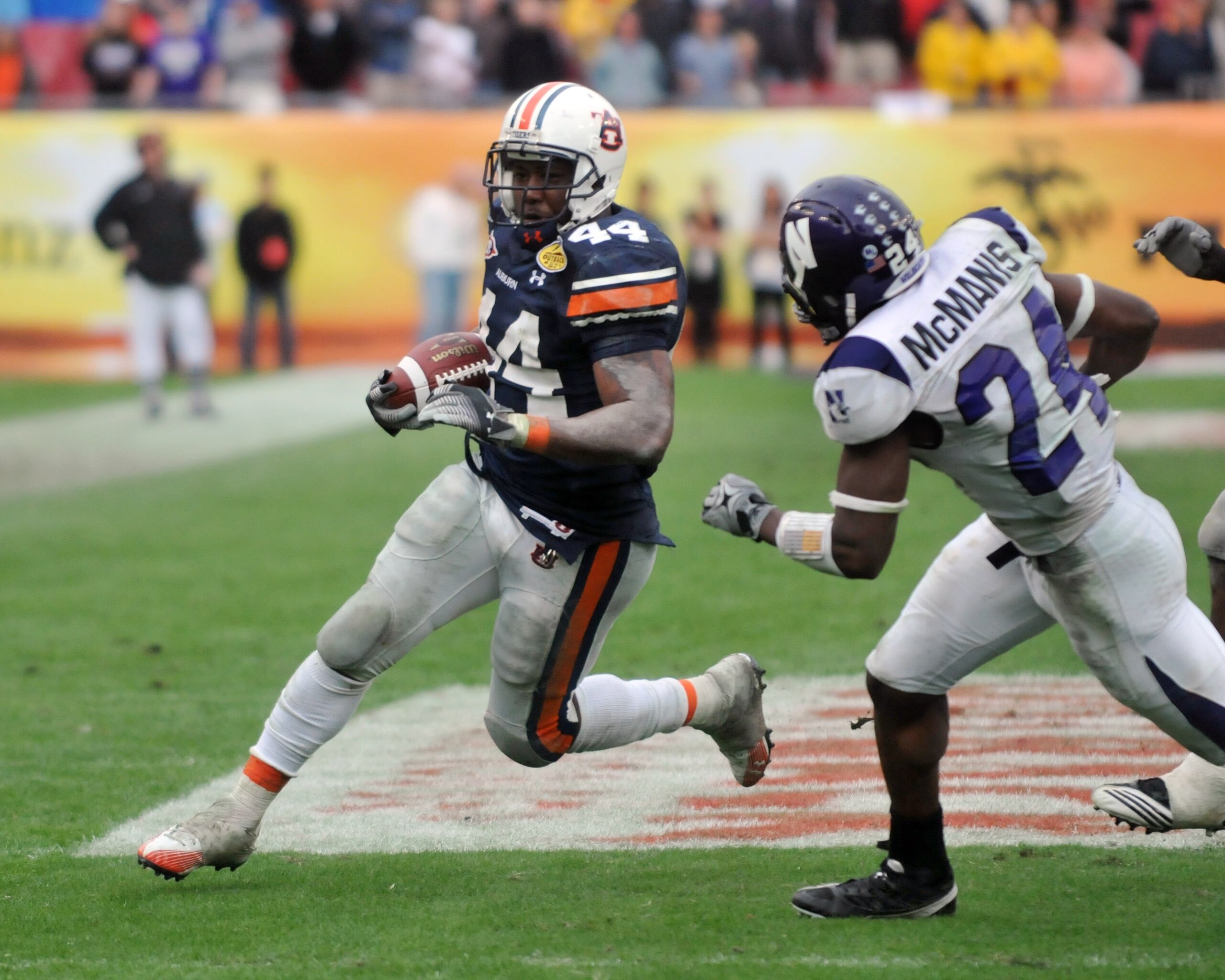 TAMPA, FL - JANUARY 1: Running back Ben Tate #44 of the Auburn Tigers rushes upfield against the Northwestern Wildcats in the Outback Bowl January 1, 2010 at Raymond James Stadium in Tampa, Florida.  (Photo by Al Messerschmidt/Getty Images)