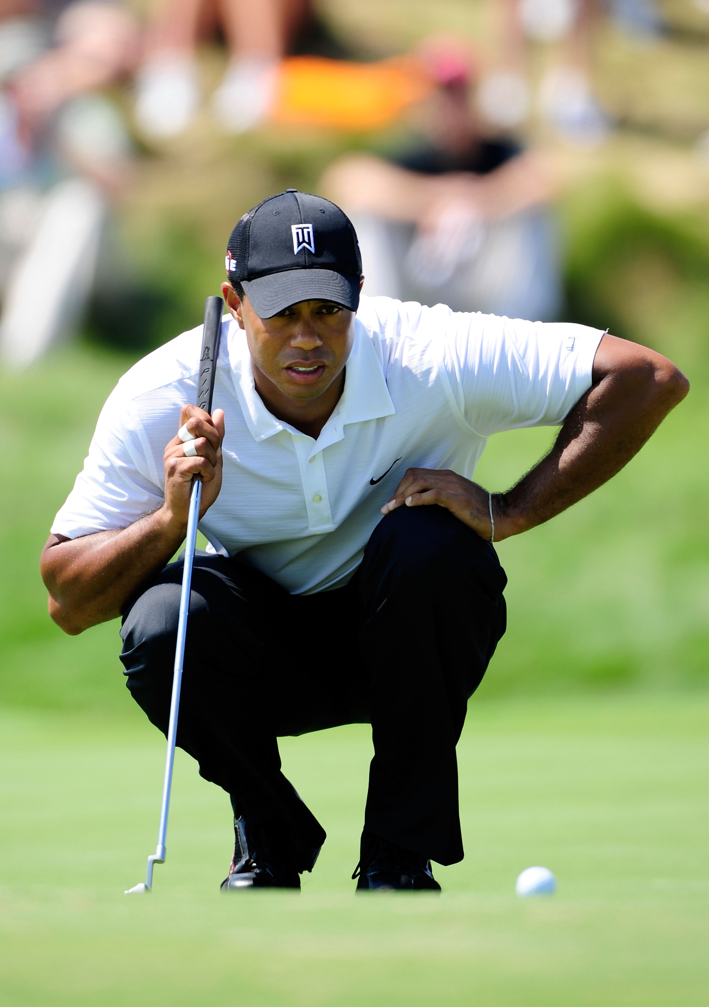 KOHLER, WI - AUGUST 12:  Tiger Woods lines up a putt on the 11th green during the first round of the 92nd PGA Championship on the Straits Course at Whistling Straits on August 12, 2010 in Kohler, Wisconsin.  (Photo by Stuart Franklin/Getty Images)