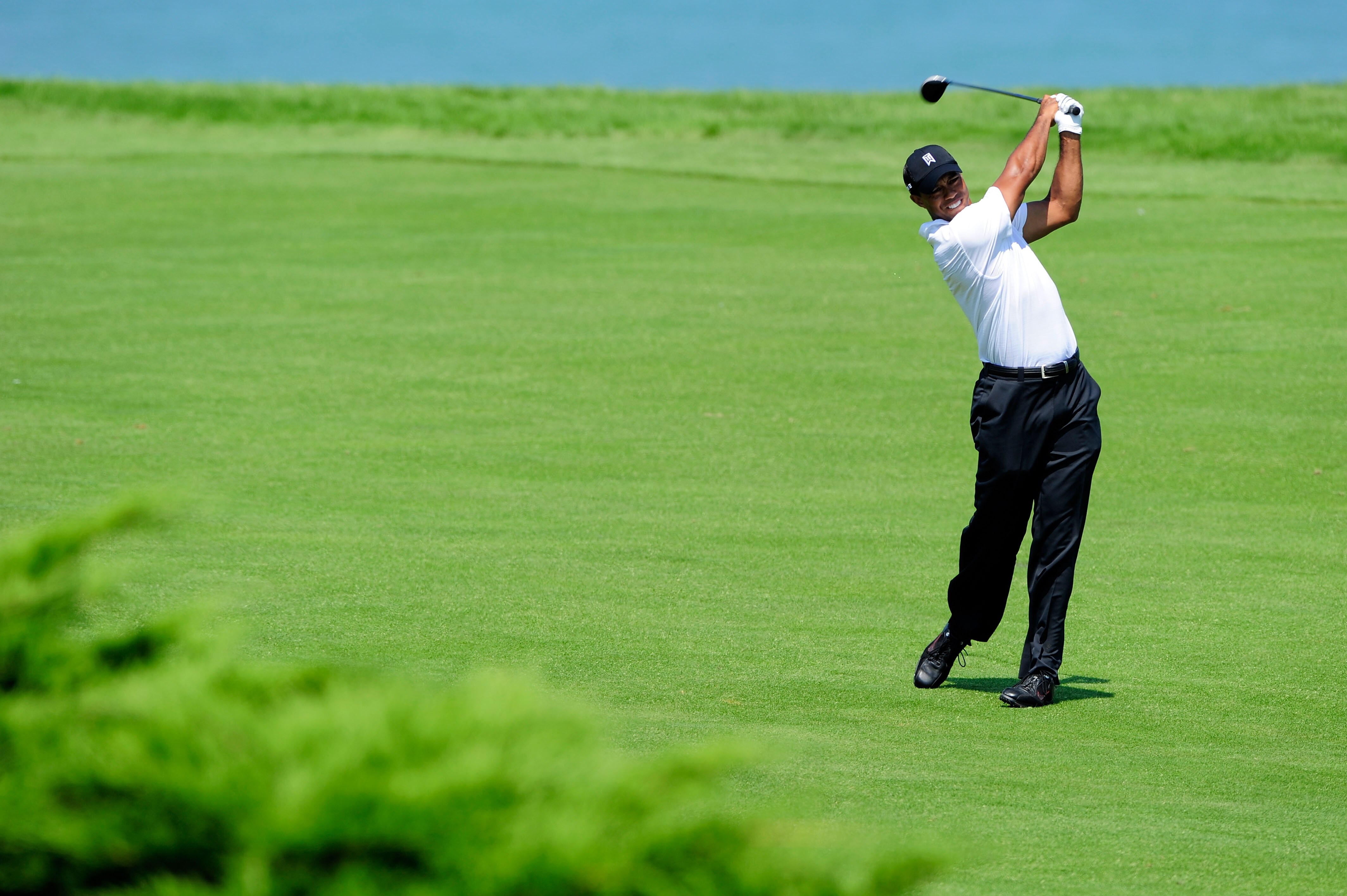 KOHLER, WI - AUGUST 12:  Tiger Woods hits his a shot on the 16th hole during the first round of the 92nd PGA Championship on the Straits Course at Whistling Straits on August 12, 2010 in Kohler, Wisconsin.  (Photo by Stuart Franklin/Getty Images)