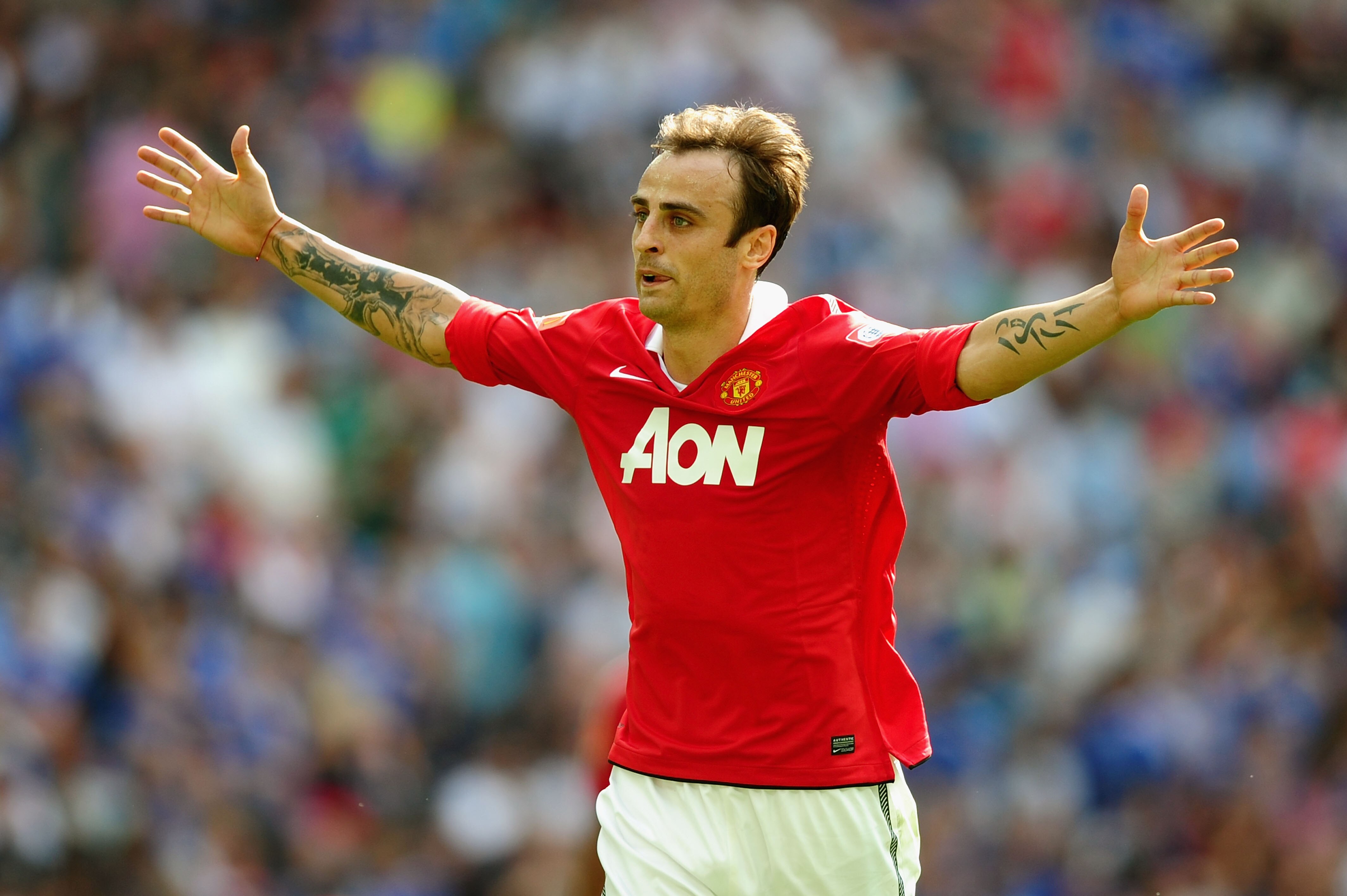 LONDON, ENGLAND - AUGUST 08:  Dimitar Berbatov of Manchester United celebrates as he scores their third goal during the FA Community Shield match between Chelsea and Manchester United at Wembley Stadium on August 8, 2010 in London, England.  (Photo by Lau