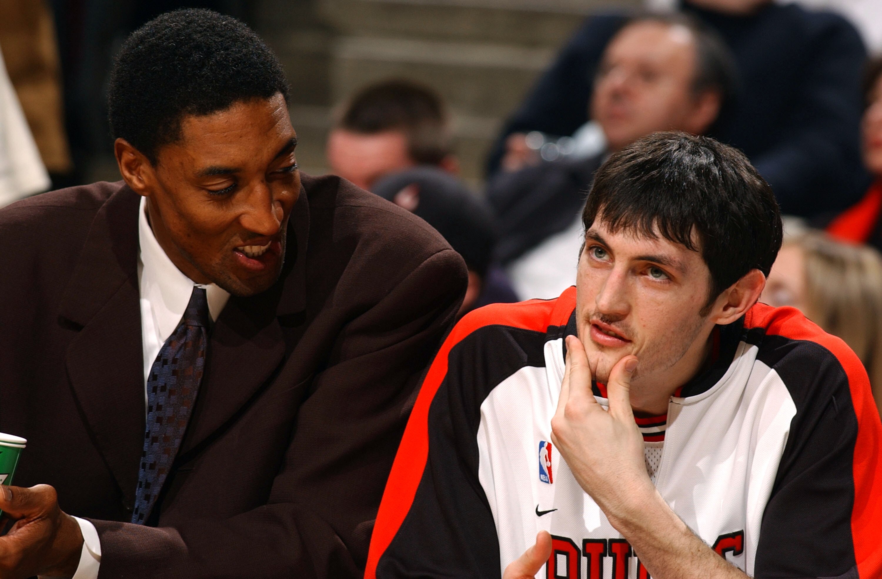 CHICAGO - FEBRUARY 25: Injured forward Scottie Pippen (l) of the Chicago Bulls talks with rookie guard Kirk Hinrich on the bench during a game against the Detroit Pistons on February 25, 2004 at the United Center in Chicago, Illinois. The Pistons defeated