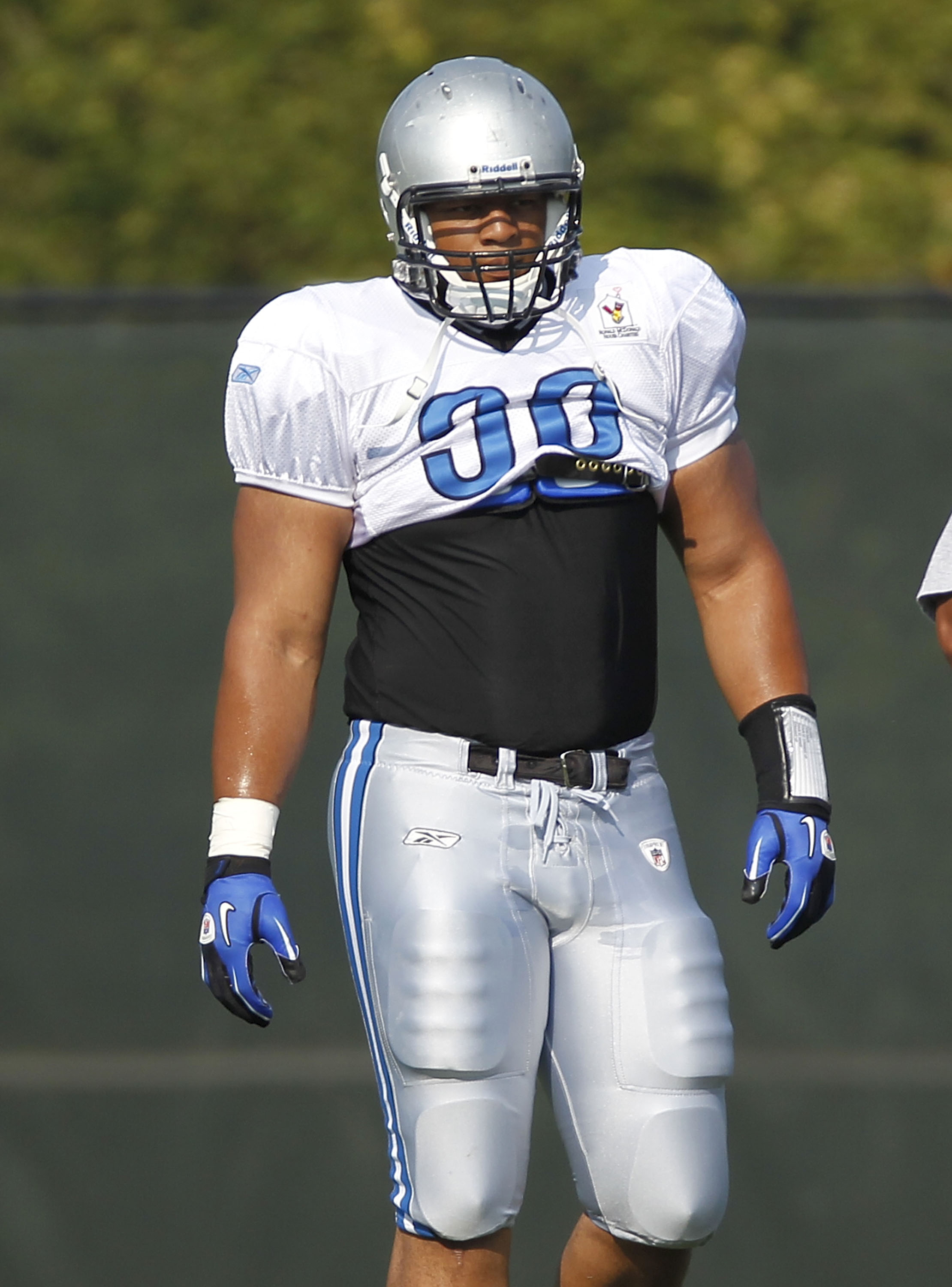 ALLEN PARK, MI - AUGUST 05:  Ndamukong Suh #90 of the Detroit Lions looks on during training camp at the Detroit Lions Headquarters and Training Facility on August 5, 2010 in Allen Park, Michigan.  (Photo by Gregory Shamus/Getty Images)