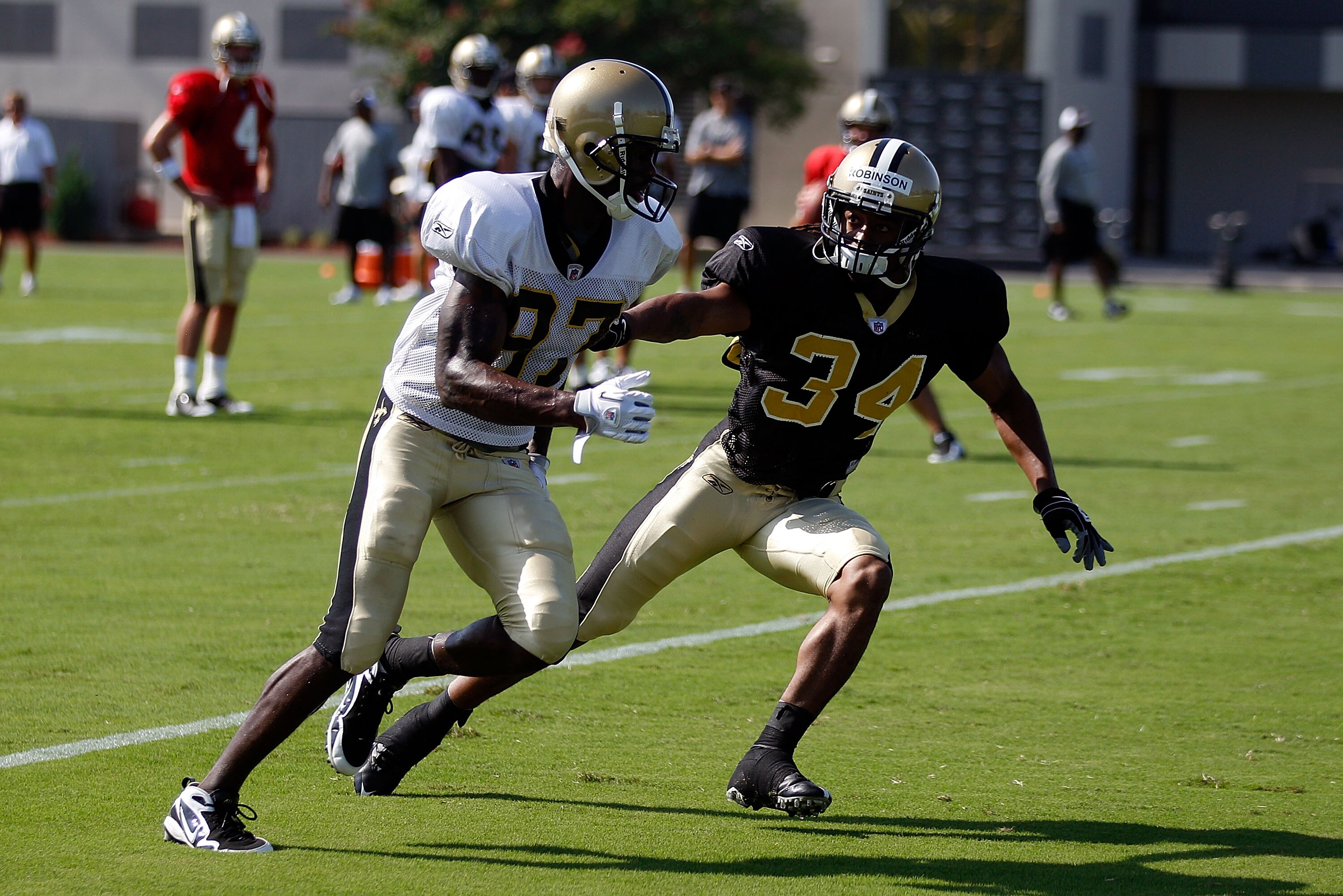 METAIRIE, LA - JULY 30:  Patrick Robinson #34 defends Adrian Arrington #87 of the New Orleans Saints during the first day of Training Camp on July 30, 2010 in Metairie, Louisiana.  (Photo by Chris Graythen/Getty Images)
