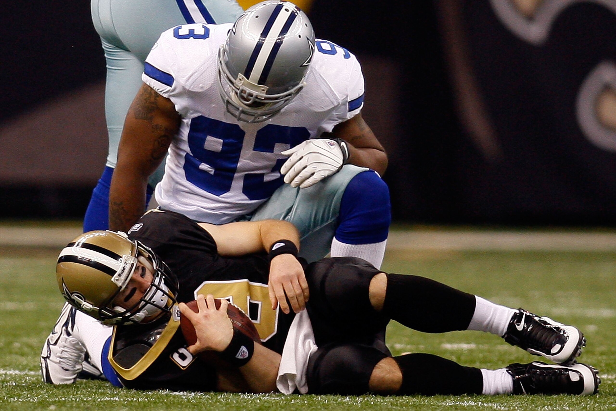 NEW ORLEANS - DECEMBER 19: Drew Brees #9 of the New Orleans Saints is sacked by Spencer Anthony #92 of the Dallas Cowboys at the Louisiana Superdome on December 19, 2009 in New Orleans, Louisiana. (Photo by Chris Graythen/Getty Images) NEW ORLEANS - DECEMBER 19: Drew Brees #9 of the New Orleans Saints is sacked by Spencer Anthony #92 of the Dallas Cowboys at the Louisiana Superdome on December 19, 2009 in New Orleans, Louisiana. (Photo by Chris Graythen/Getty Images)