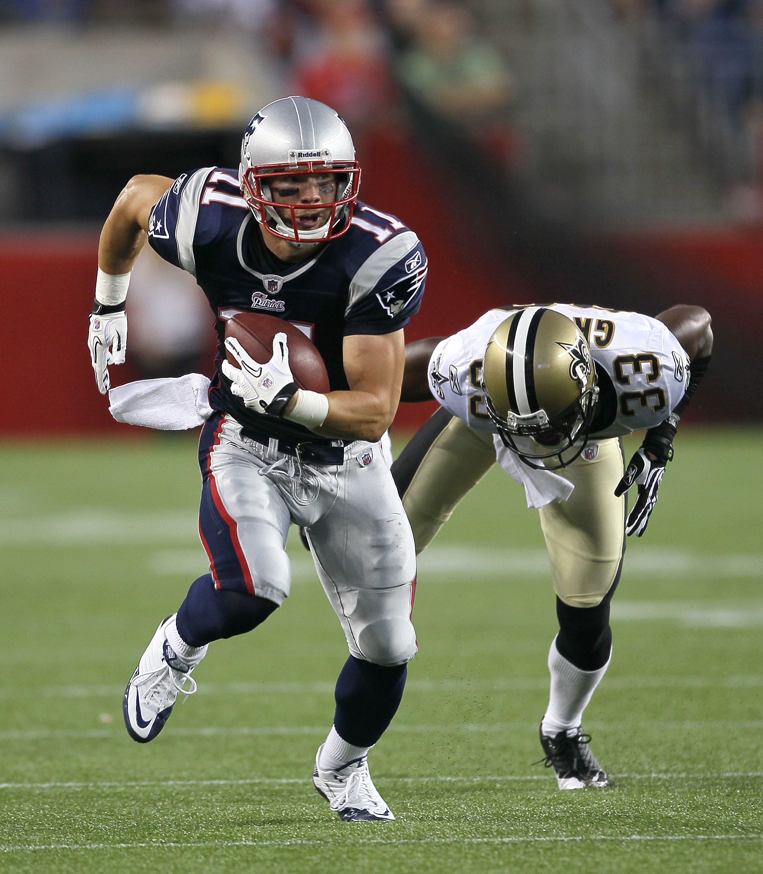 FOXBORO, MA - AUGUST 12: Aaron Hernandez  #85 and Tom Brady #12 of the New England Patriots greet each other before the the preseason game against the New Orleans Saints at Gillette Stadium on August 12, 2010 in Foxboro. Massachusetts. (Photo by Jim Rogas