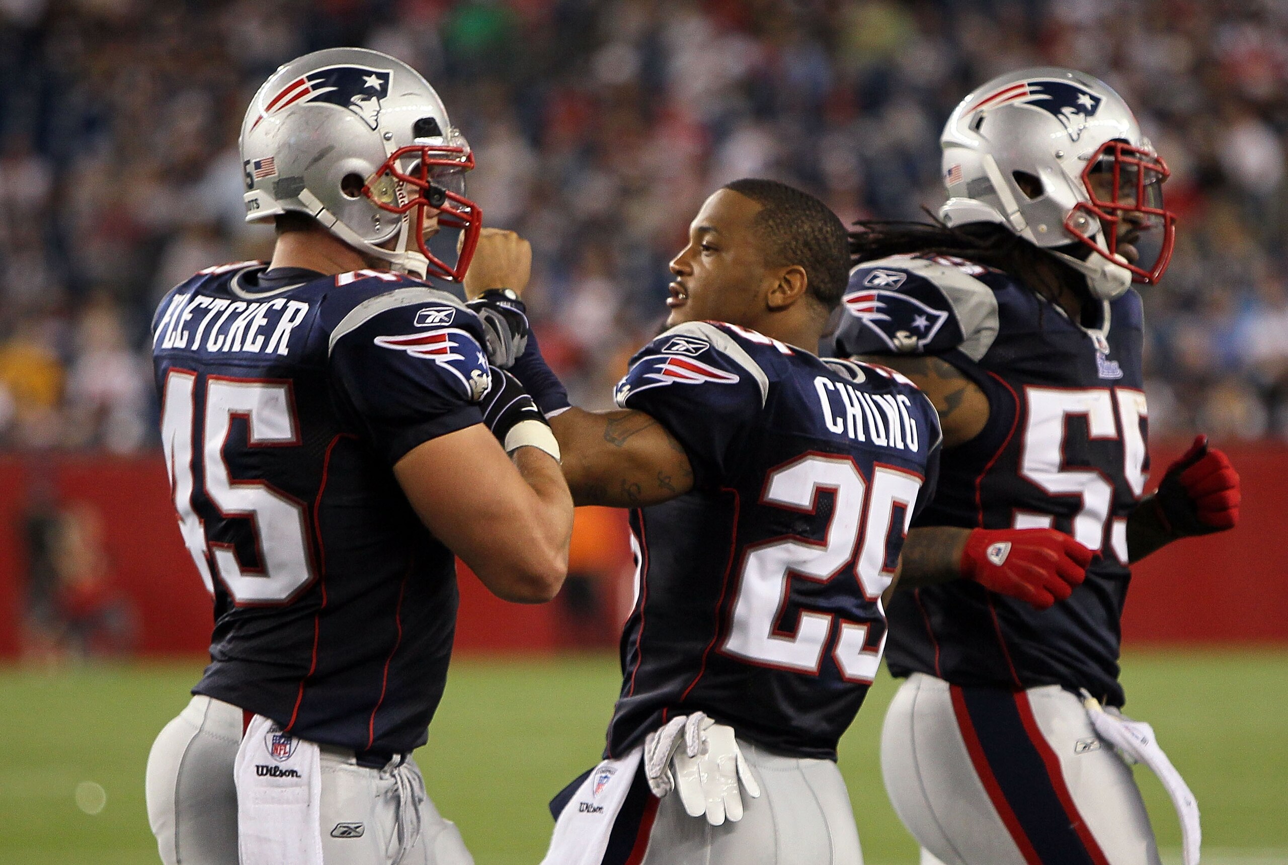 FOXBORO, MA - AUGUST 12: Patrick Chung # 25 greets Dane Fletcher # 45 and Brandon Spikes # 55 of the New England Patriots during the second half of a preseason game against the New Orleans Saints at Gillette Stadium on August 12, 2010 in Foxboro, Massachu