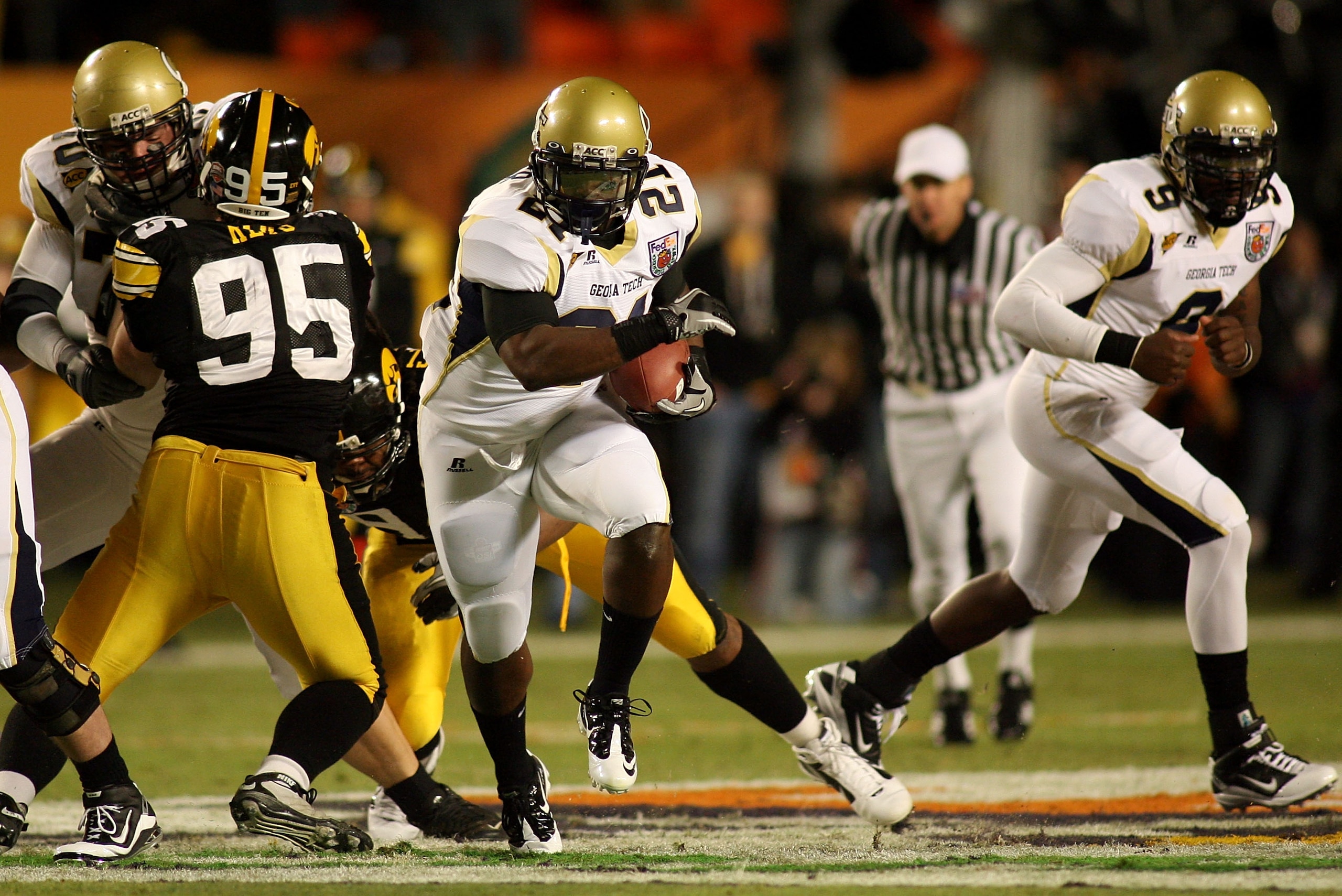 MIAMI GARDENS, FL - JANUARY 05: Jonatha Dwyer #21 of the Georgia Tech Yellow Jackets runs the ball against the Iowa Hawkeyes during the FedEx Orange Bowl at Land Shark Stadium on January 5, 2010 in Miami Gardens, Florida. (Photo by Marc Serota/Getty Ima MIAMI GARDENS, FL - JANUARY 05: Jonatha Dwyer #21 of the Georgia Tech Yellow Jackets runs the ball against the Iowa Hawkeyes during the FedEx Orange Bowl at Land Shark Stadium on January 5, 2010 in Miami Gardens, Florida. (Photo by Marc Serota/Getty Ima