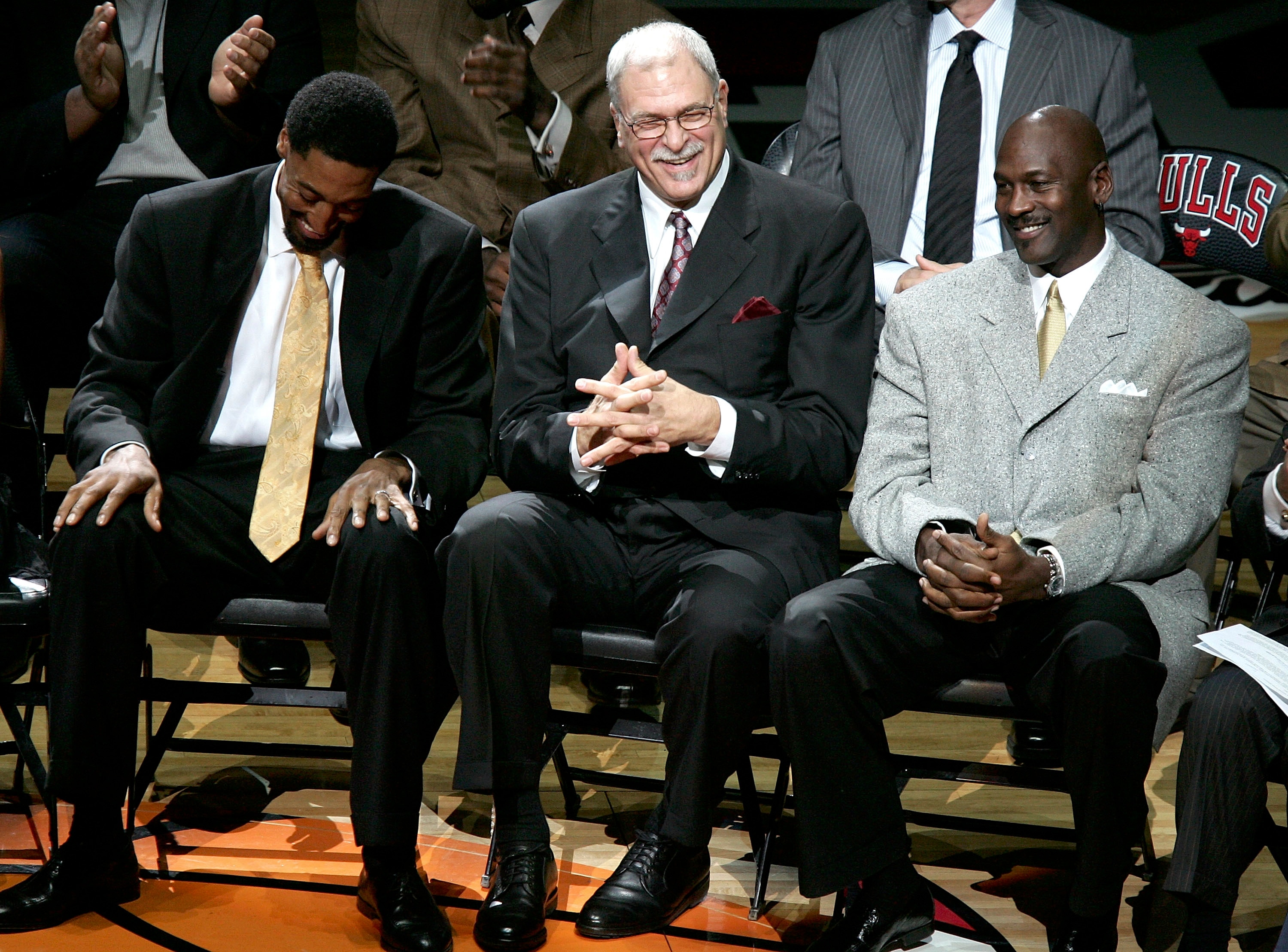 CHICAGO - DECEMBER 9:  (L-R) Scottie Pippen, Phil Jackson and Michael Jordan, formerly of the Chicago Bulls, enjoy a laugh during a ceremony retiring Pippen's #33 at halftime of a game between the Bulls and the Los Angeles Lakers on December 9, 2005 at th