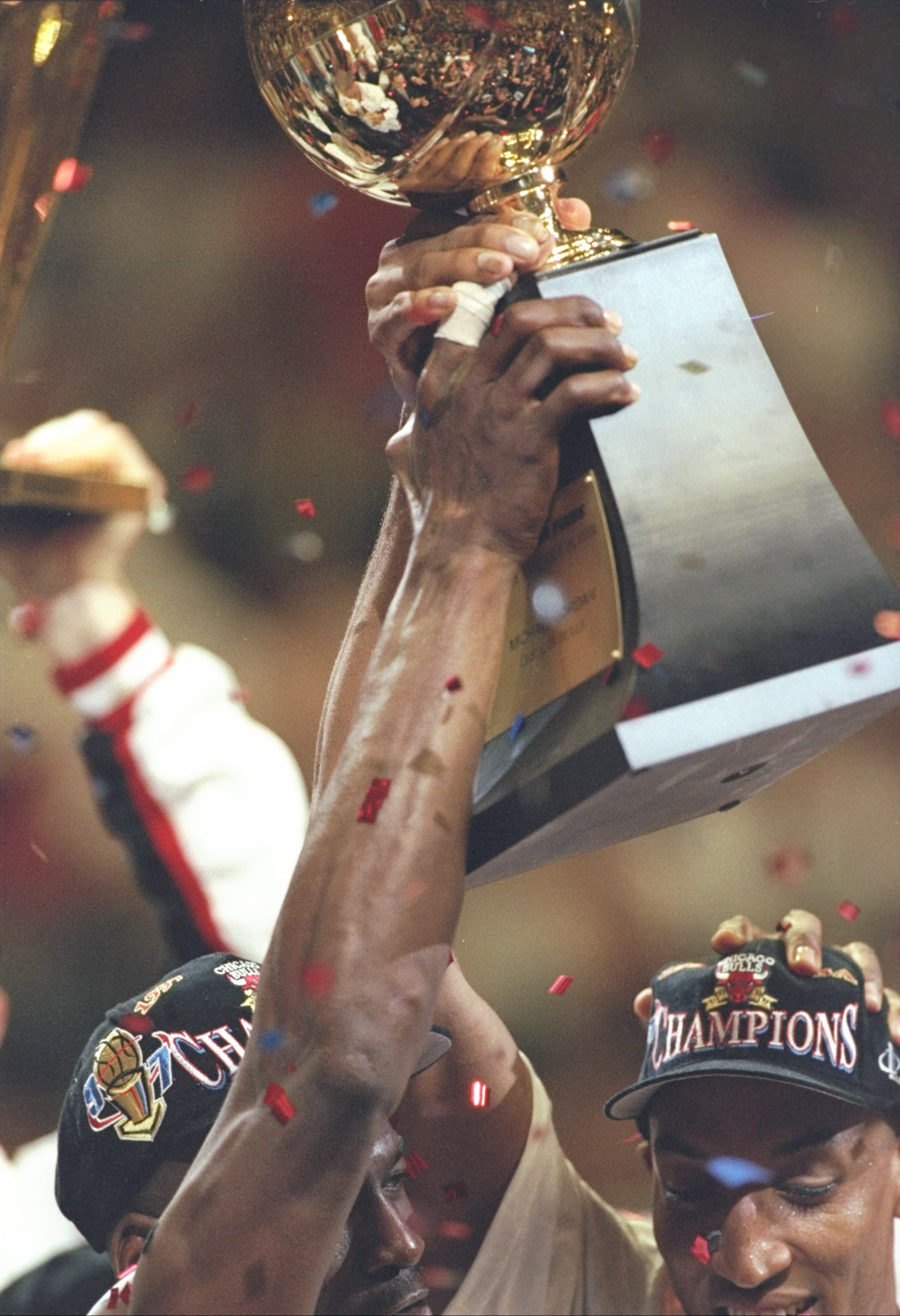 13 Jun 1997:  Scottie Pippen of the Chicago Bulls cheers as Michael Jordan (L) celebrates his MVP trophy after the Bulls win game 6 of the 1997 NBA Finals at the United Center in Chicago, Illinois. The Bulls defeated the Jazz 90-86 to win the series and c