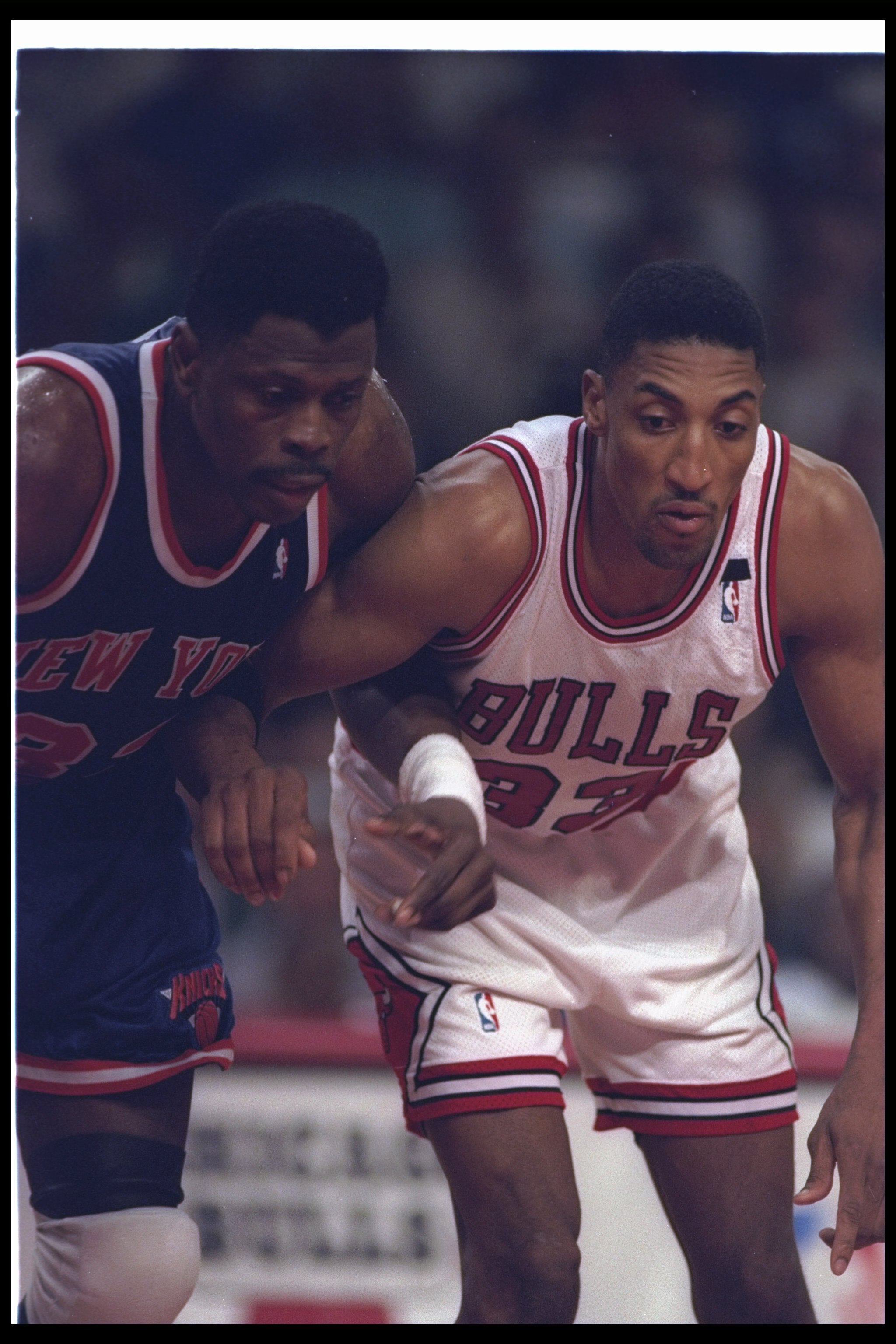 24 Apr 1994: Forward Scottie Pippen of the Chicago Bulls (right) and center Patrick Ewing of the New York Knicks look on during a game at the United Center in Chicago, Illinois. The Knicks won the game, 92-76.