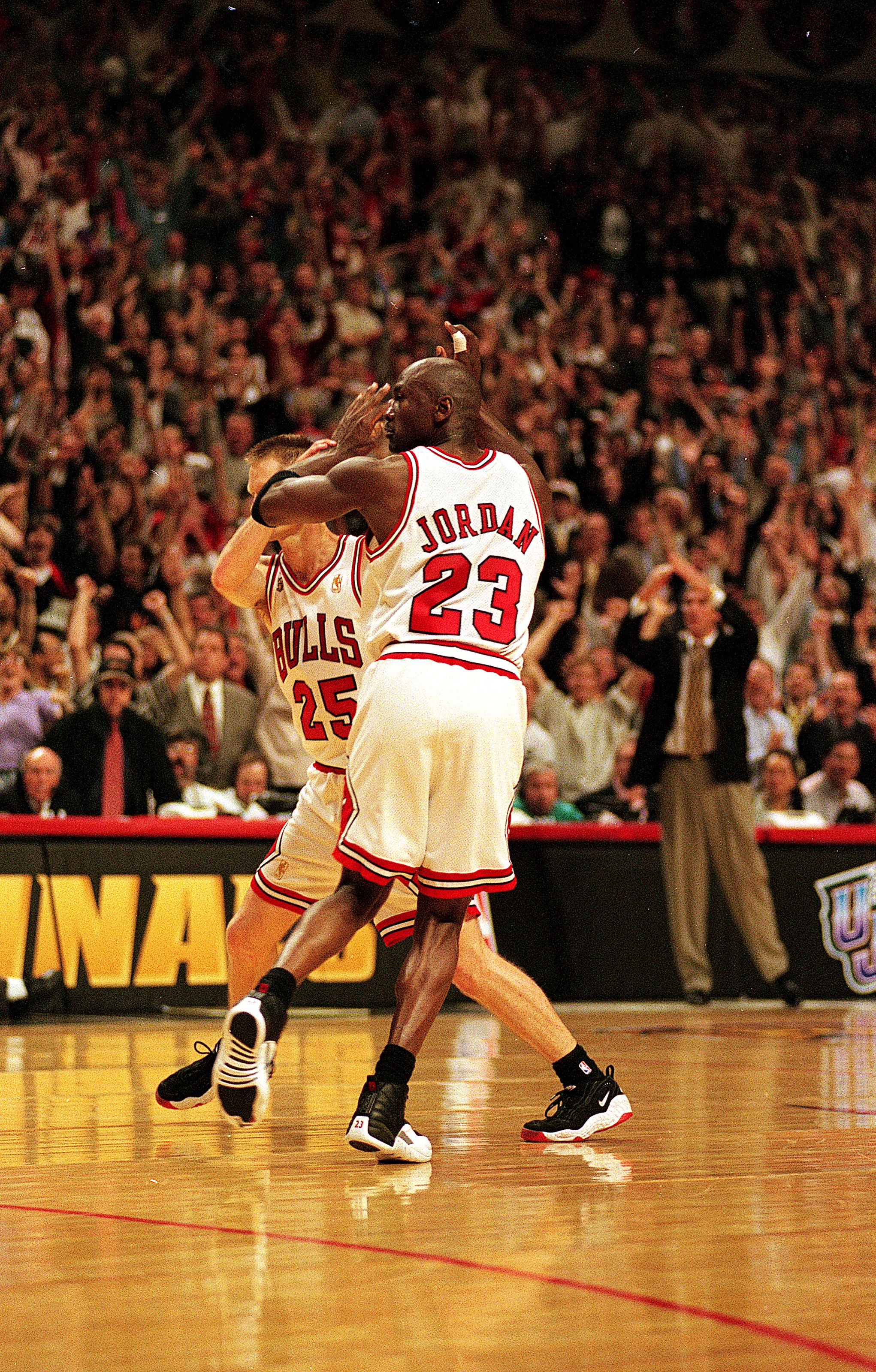I3 Jun 1997:  Michael Jordan #23 of the Chicago Bulls celebrates with teammates Steve Kerr #25 during game six of the NBA Final against the Utah Jazz at the United Center in Chicago, Illinois. The Bulls defeated the Jazz 90-86..   Mandatory Credit: Jonath