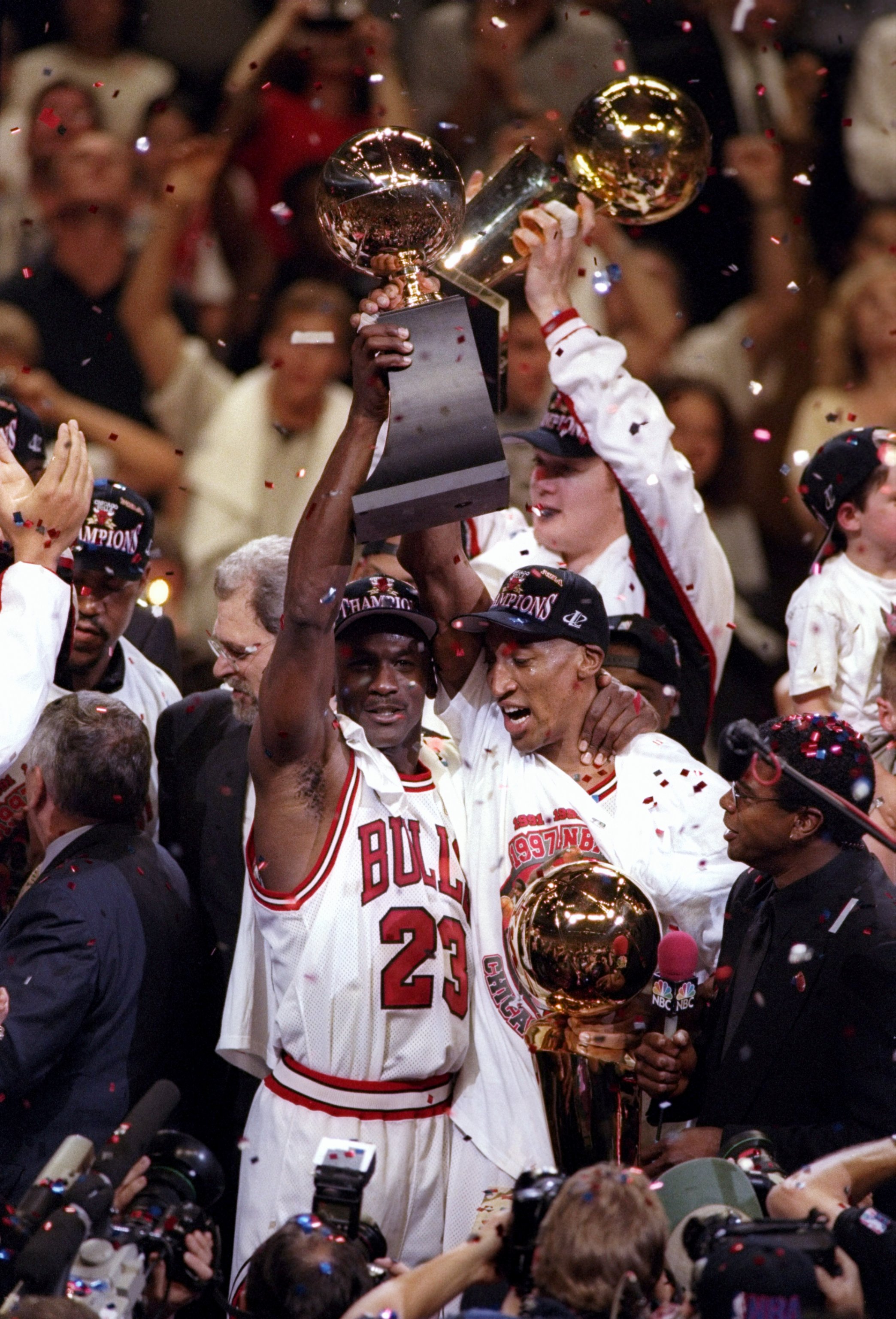 13 Jun 1997:  Michael Jordan #23 and Scottie Pippen of the Chicago Bulls celebrate with the trophy after winning game 6 of the 1997 NBA Finals at the United Center in Chicago, Illinois. The Bulls defeated the Jazz 90-86 to win the series and claim the cha