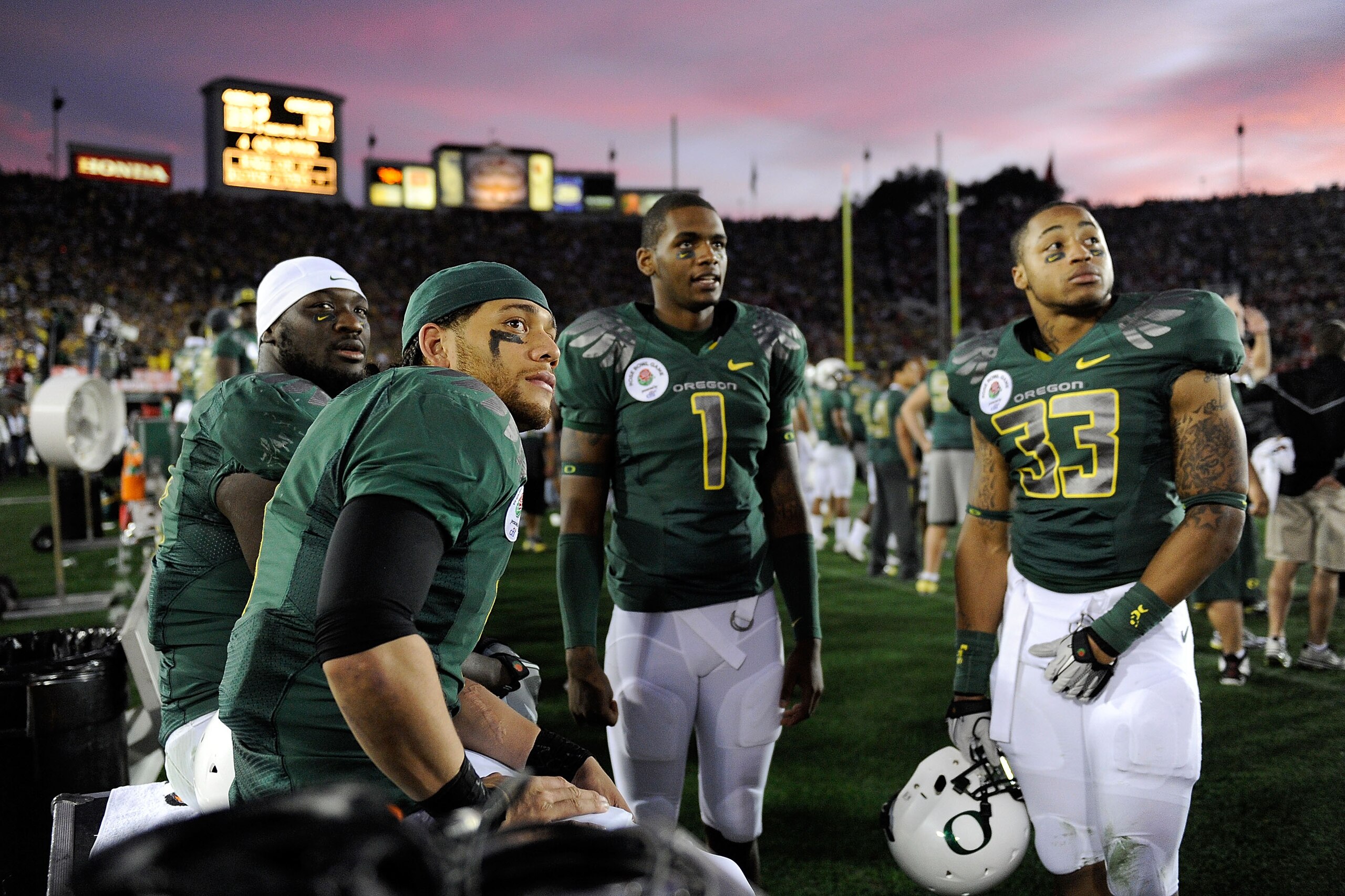 PASADENA, CA - JANUARY 01: (L-R) Running back LeGarrette Blount #8, quarterback Jeremiah Masoli #9, quarterback Darron Thomas #1, and defensive end Tyrell Irvin #33 of the Oregon Ducks react to a touchdown by the Ohio State Buckeyes during the 96th Rose PASADENA, CA - JANUARY 01: (L-R) Running back LeGarrette Blount #8, quarterback Jeremiah Masoli #9, quarterback Darron Thomas #1, and defensive end Tyrell Irvin #33 of the Oregon Ducks react to a touchdown by the Ohio State Buckeyes during the 96th Rose